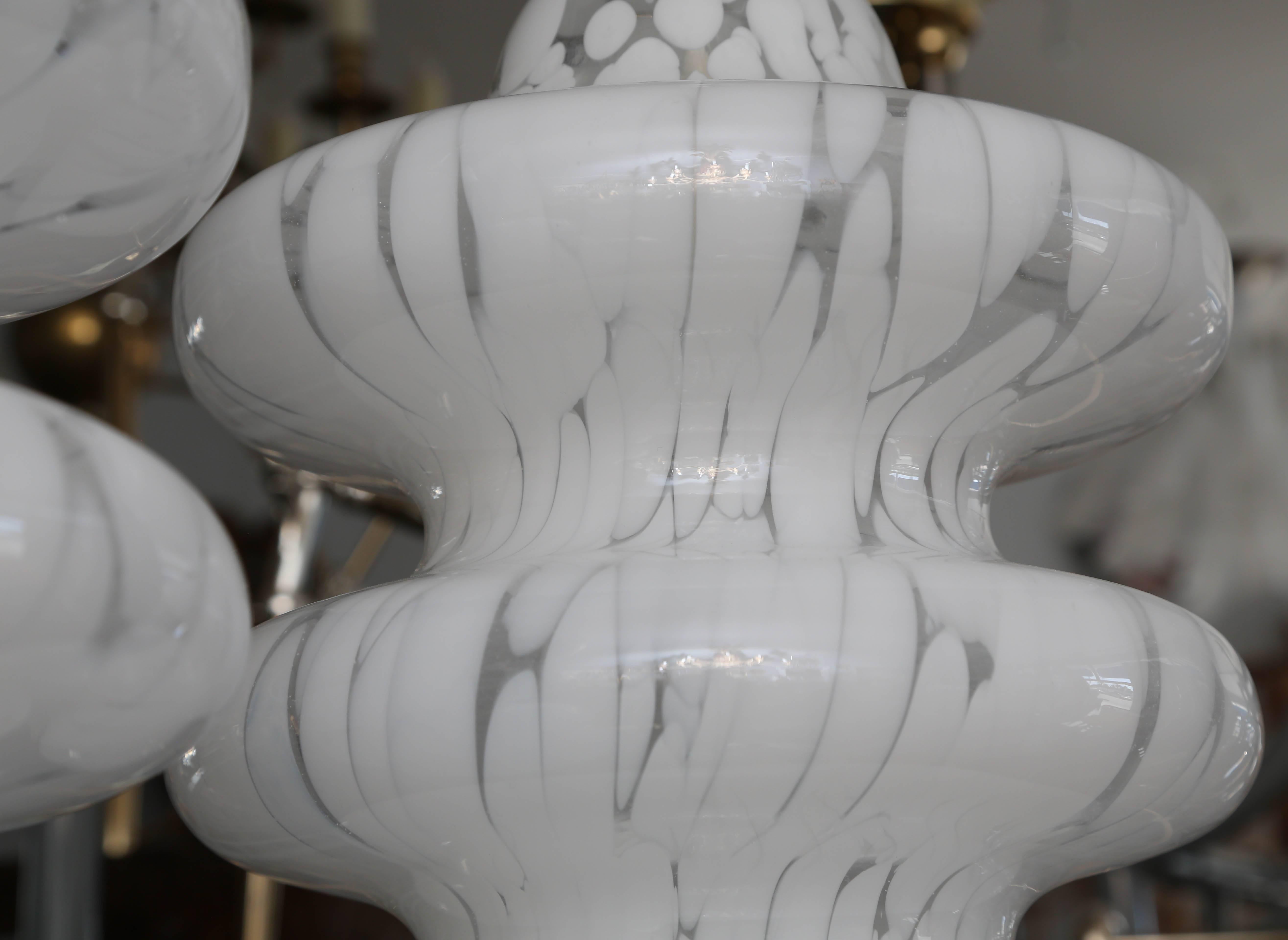 Unusual form. The pair are appointed with chrome bases.
Cloud-like white color and form.
