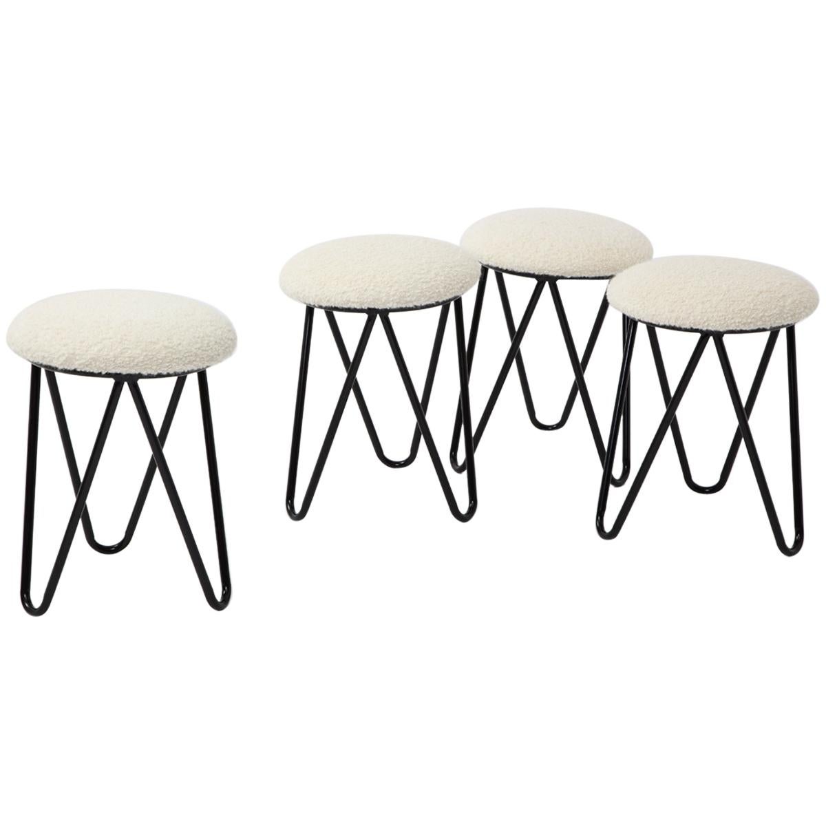 Four tripod Iron Stools