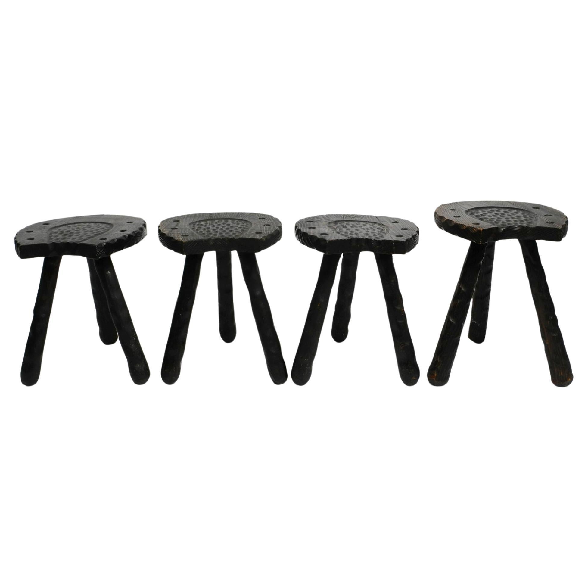 Four unusual Mid Century three-legged "horseshoe" stools made of pine wood  For Sale