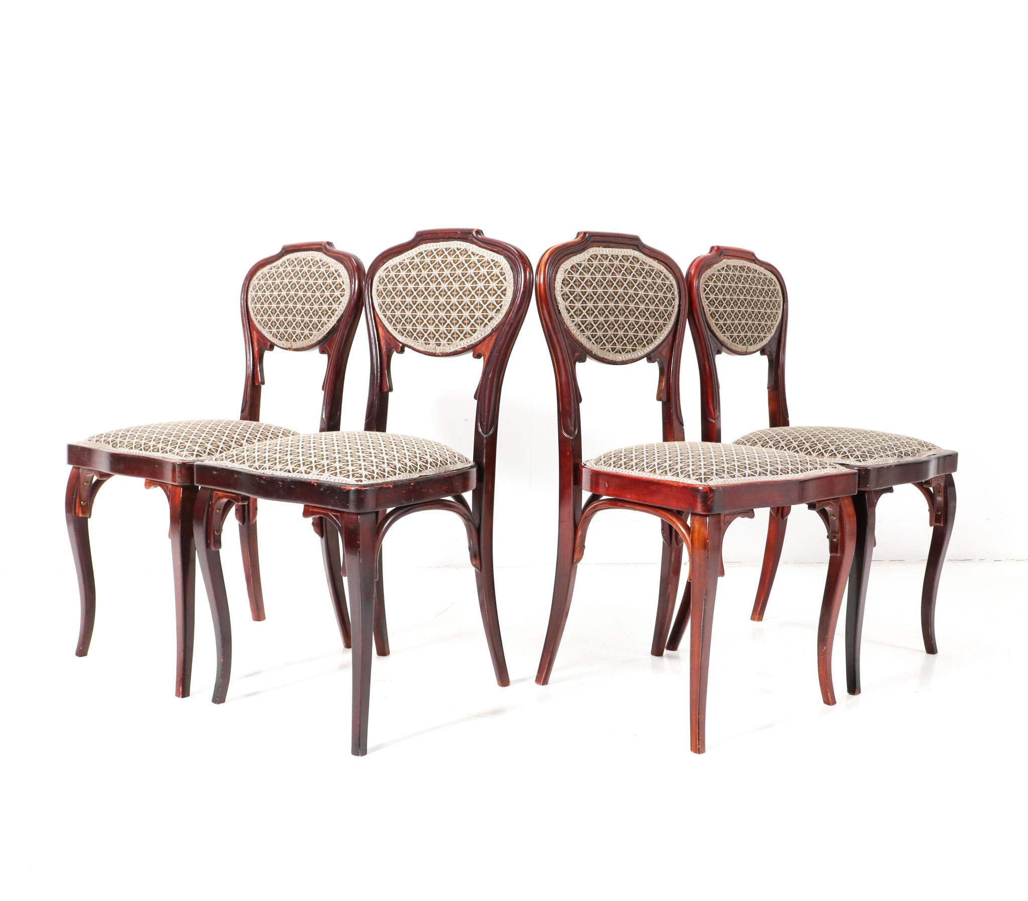 Magnificent and rare set of four Vienna Secession side chairs.
Design by Jacob and Josef Kohn.
Striking Austrian design from the 1900s.
Original lacquered beech and bentwood curved frames.
Re-upholstered with Backhausen new fabric.
Re-upholstered