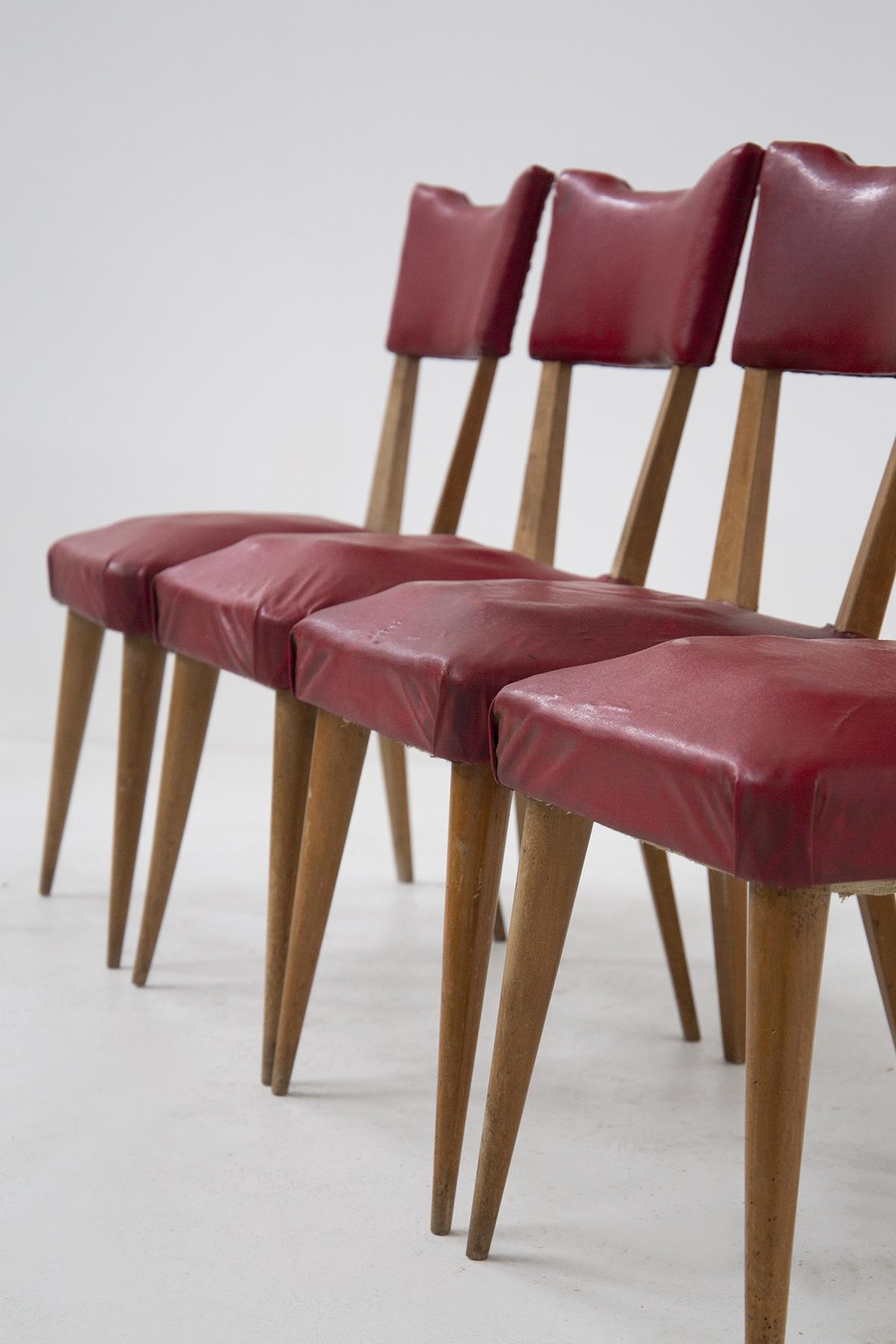 This beautiful set of four vintage chairs is from the '50s. With a solid structure in wood and upholstered in red sky leather, the vintage chairs are of fine French manufacture. They are most suitable for vintage rooms with an important aesthetic,
