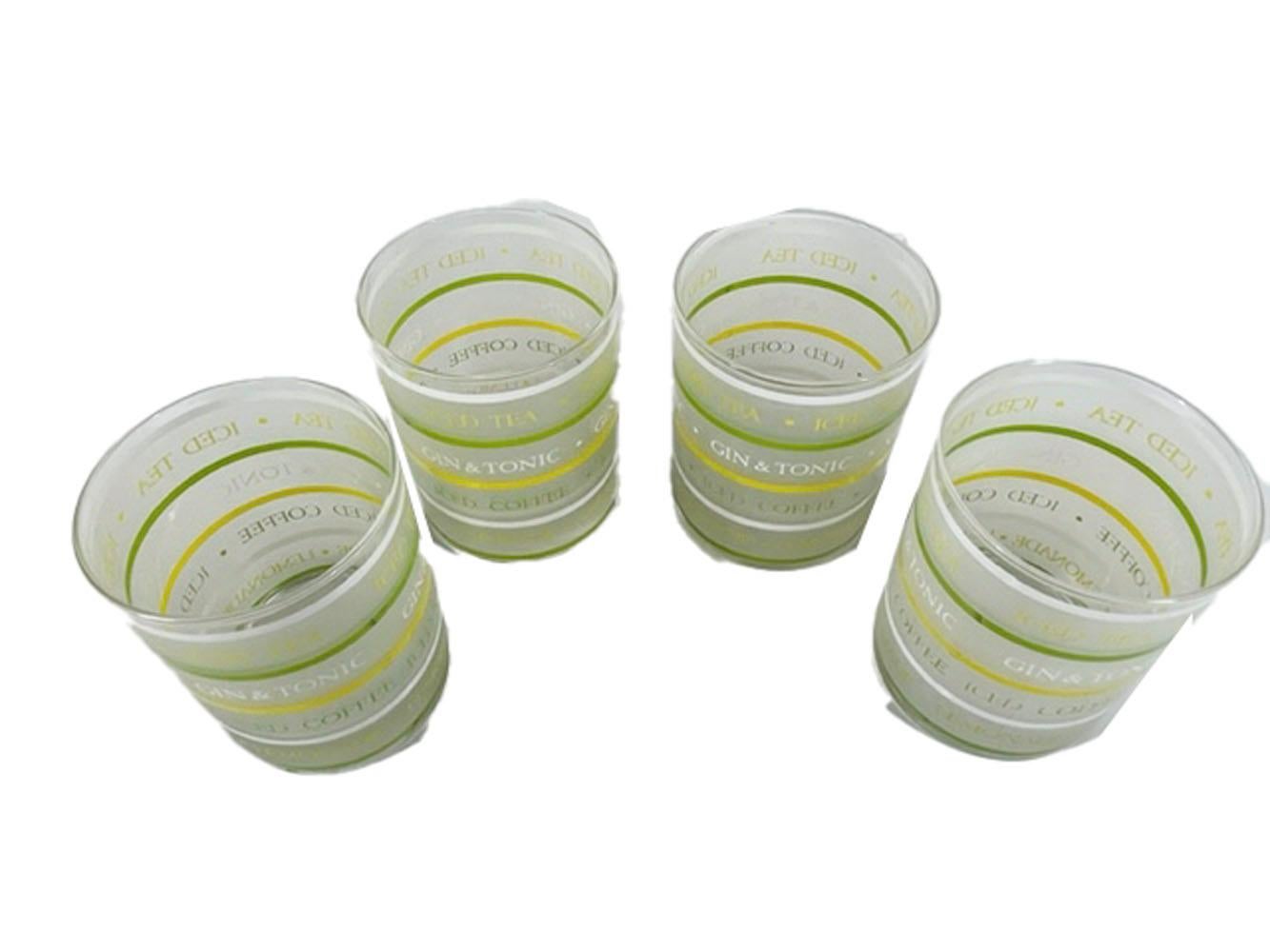 Four mid-century rocks glasses by Culver, LTD in the Gin & Tonic pattern having horizontal bands in green, white and yellow with the drink names 