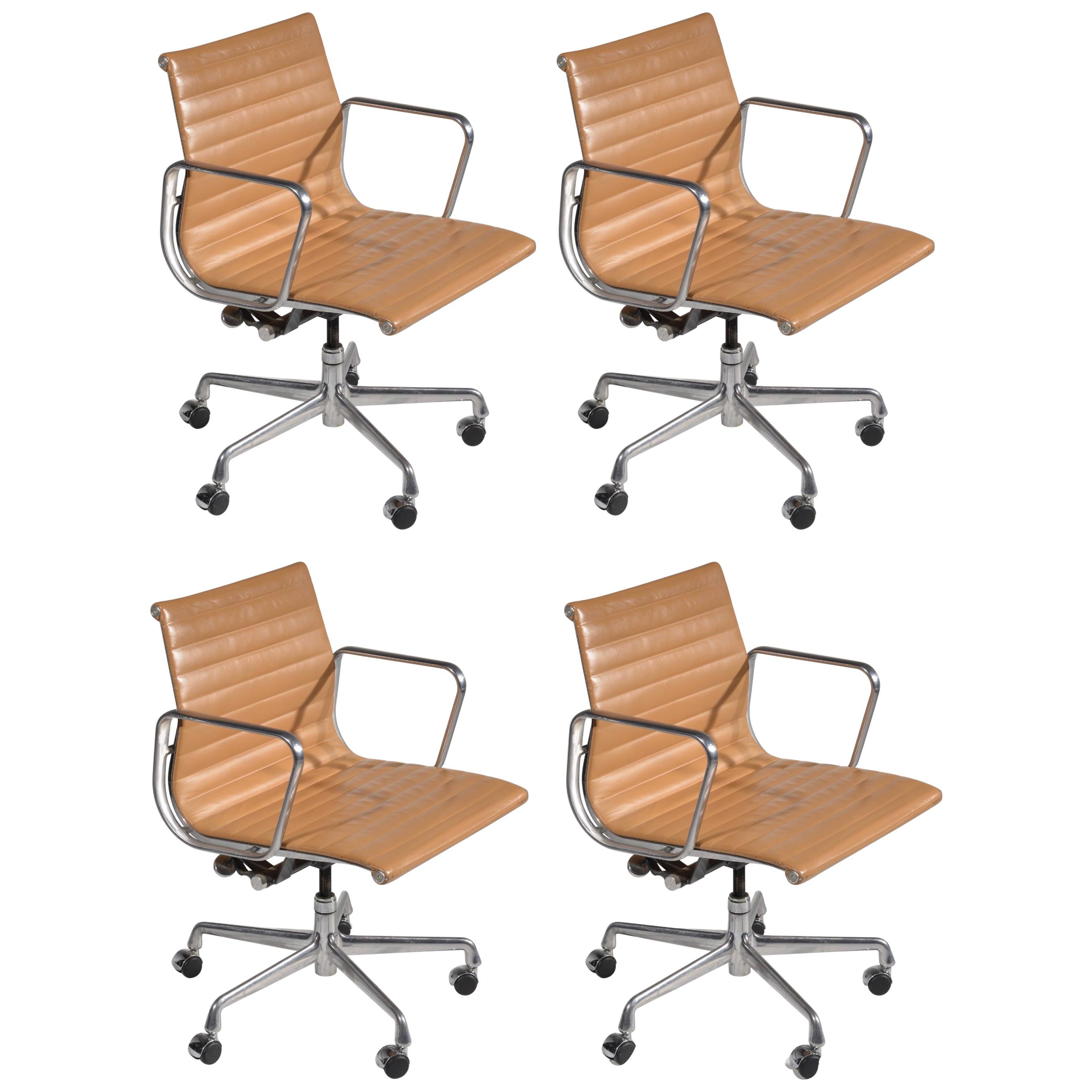 Four Vintage Eames Aluminum Group Leather "Management" Chairs in Tan Leather