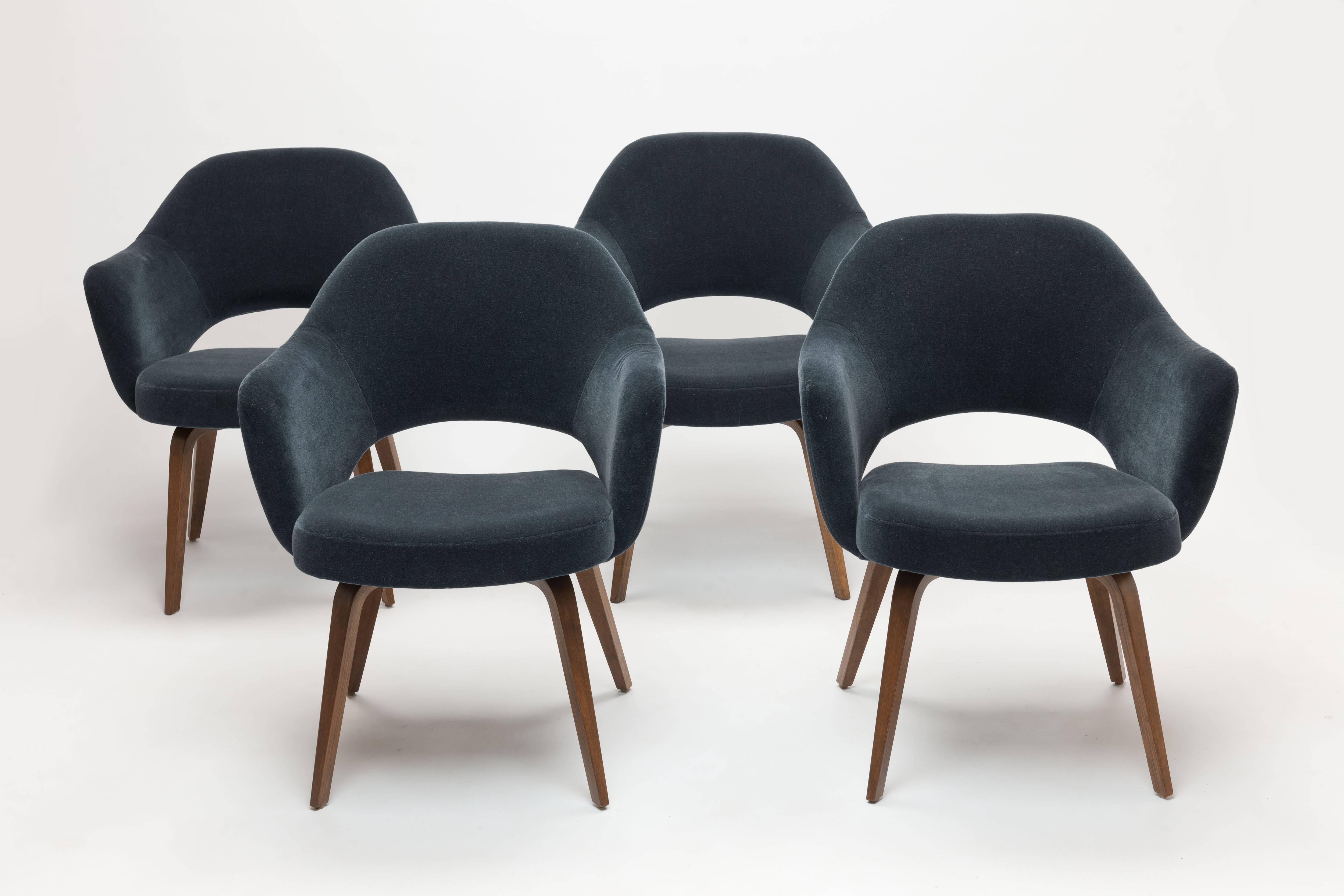Four vintage Eero Saarinen for Knoll executive armchairs or dining chairs with Wooden Legs in most exclusive blue-grey velvet mohair upholstery. This is 'Knoll Velvet' fabric, the most expensive fabric option that Knoll offers. New price in this