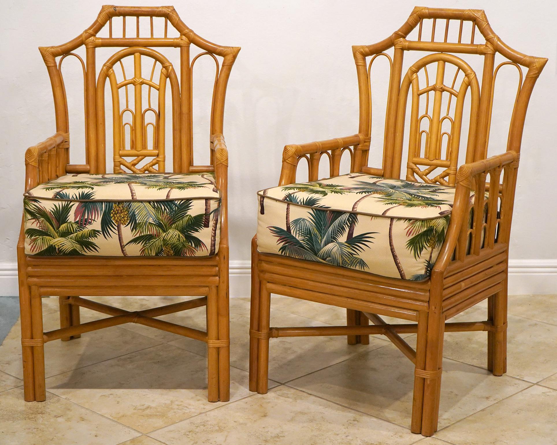 These fabulous and intricately designed Chinoiserie style rattan armchairs feature the pagoda style backrests, seats with cushions and very beautiful joints made in the traditional way.