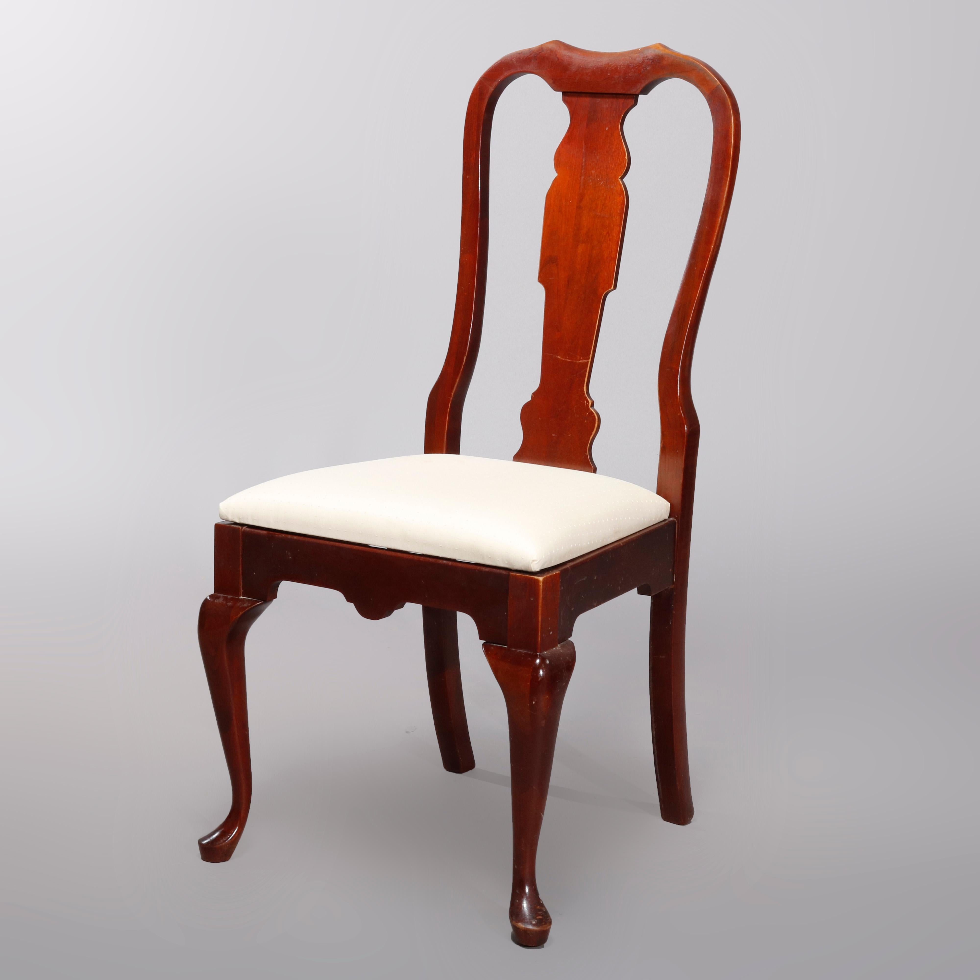 A vintage set of 4 dining chairs by Pennsylvania House offer cherry construction in Queen Anne styling with backs having shaped rail and stylized urn slat backs over upholstered seats raised on cabriole legs with pad feet, signed beneath as