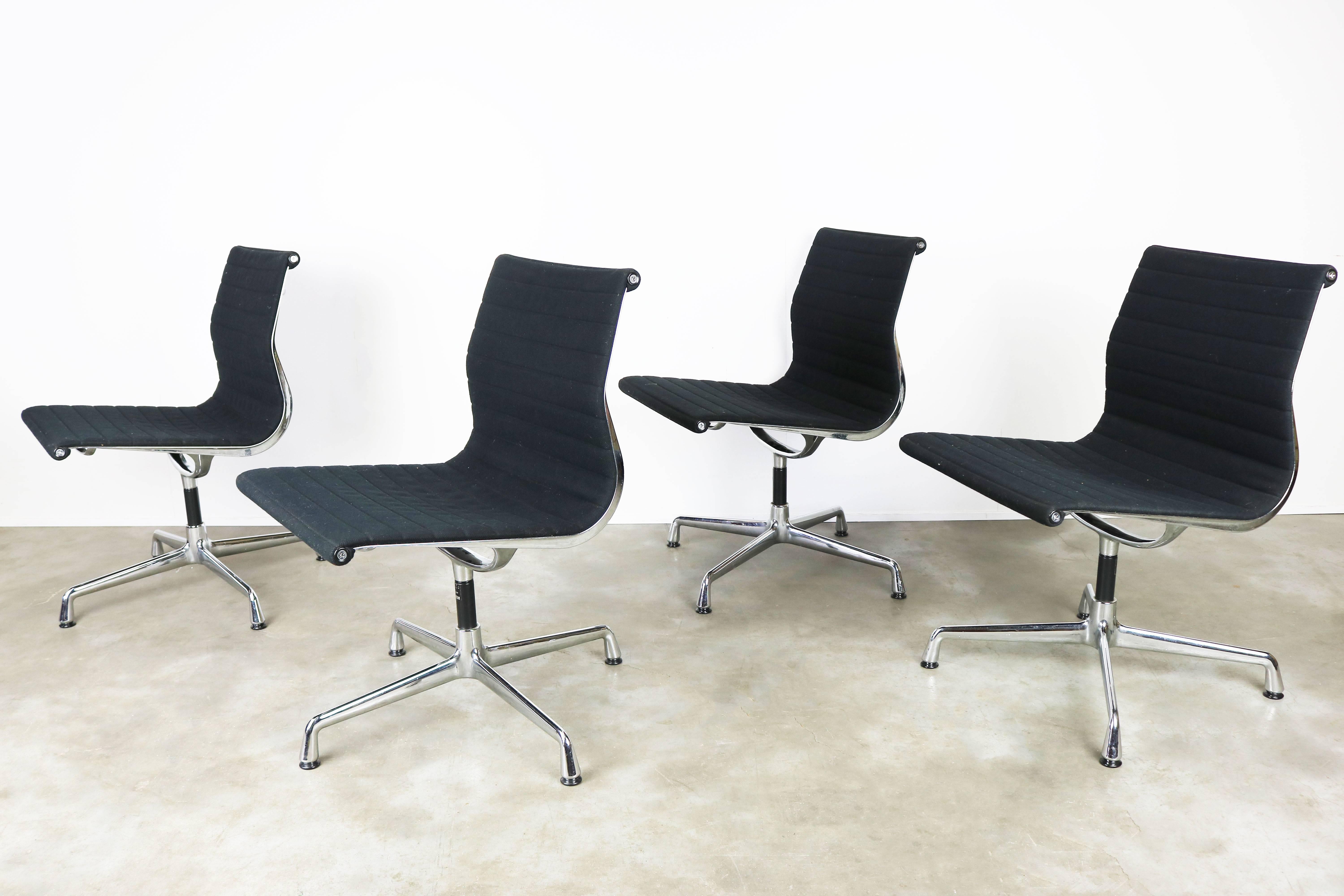 A set of four wonderful and famous vintage model: EA 106 swivel office chairs by Charles & Ray Eames produced by Vitra / Herman Miller in the early 1980s. The chairs have always been a statement of class and comfort , this set reflects that
