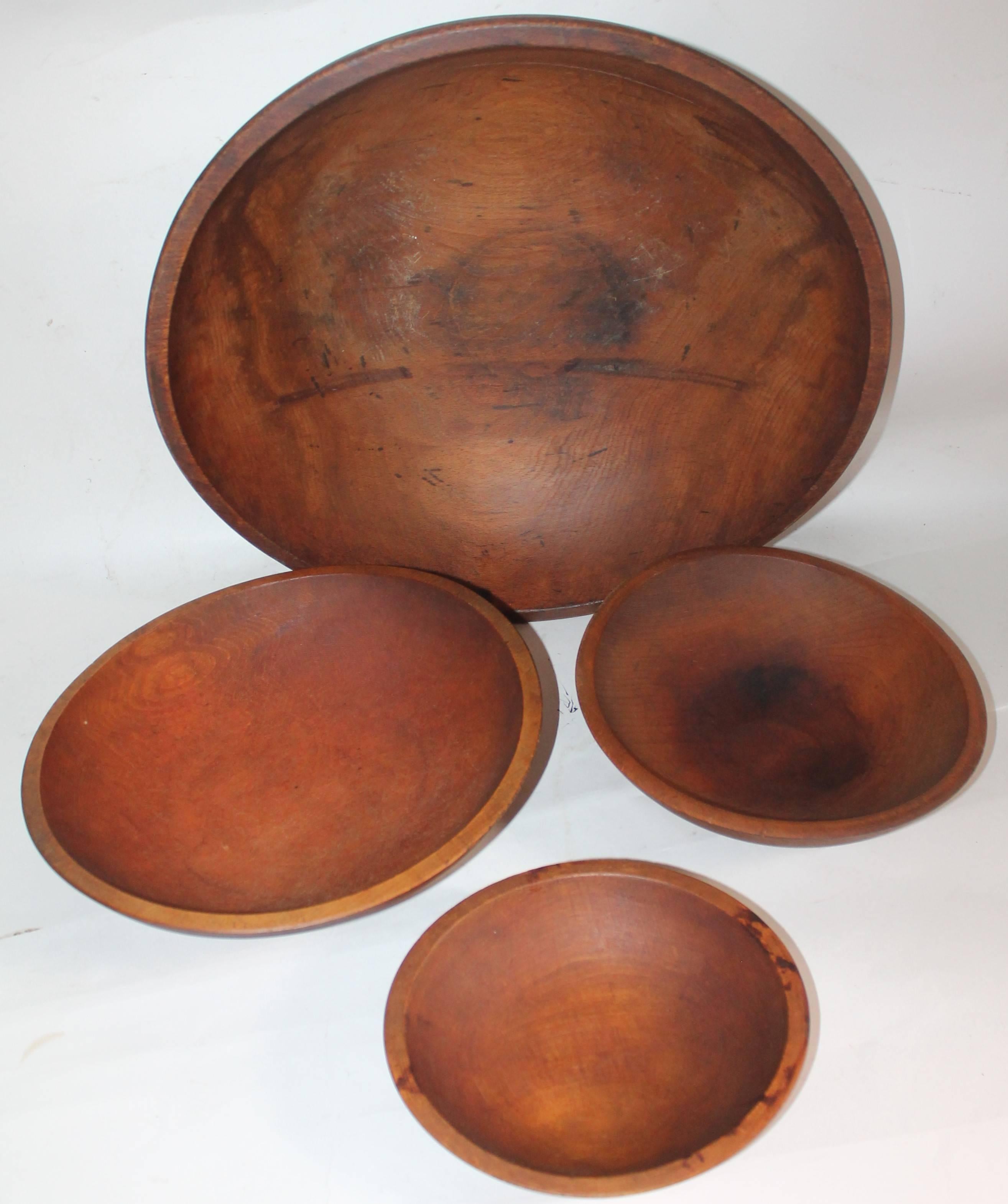 19th century collection of four 19th century large butter bowls. Measure-
18 inches in diameter by 5.5 inches in height

Medium bowls measure -
12 inches in diameter by 3.5 inches in height 
10 inches in diameter by 2.5 inches in