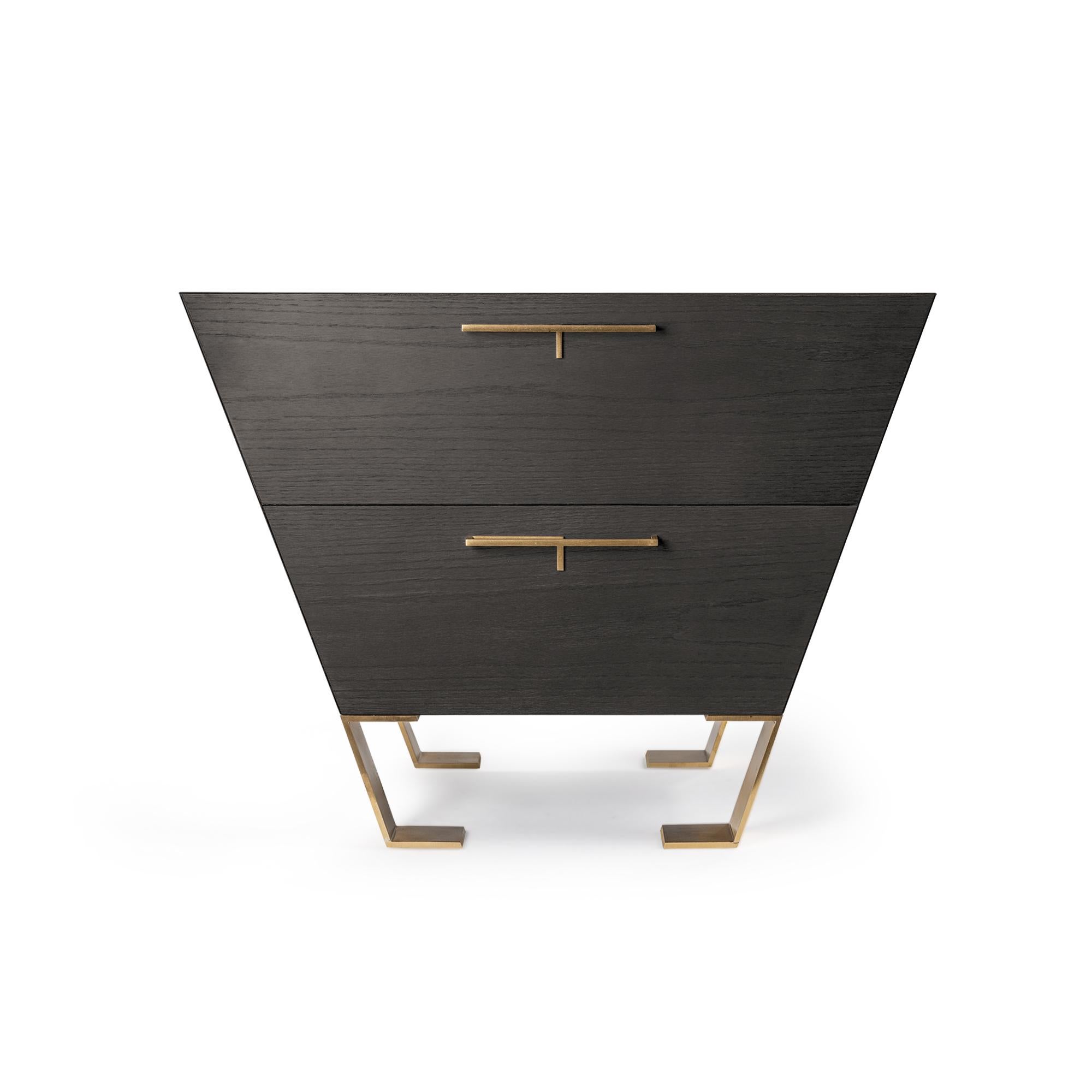 The shape of this container with drawers is defined by its sinuous lines and 45-degree cuts. Although part of the Fourmosa credenza, this piece was designed to maintain its same elegance when used alone, as well. This piece is a product of masterful
