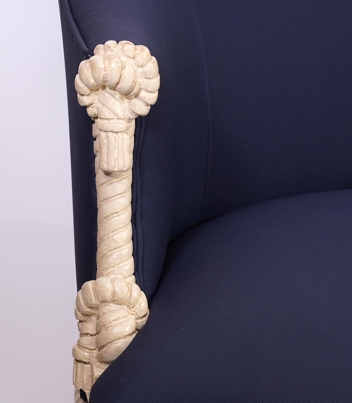 This unusual and intriguing chair is fashioned in the manner of A. M. E. Fournier, a famous 19th century French furniture designer. They feature a carved and painted rope, knot and tassel frame and attractive blue upholstery. The chair bears the