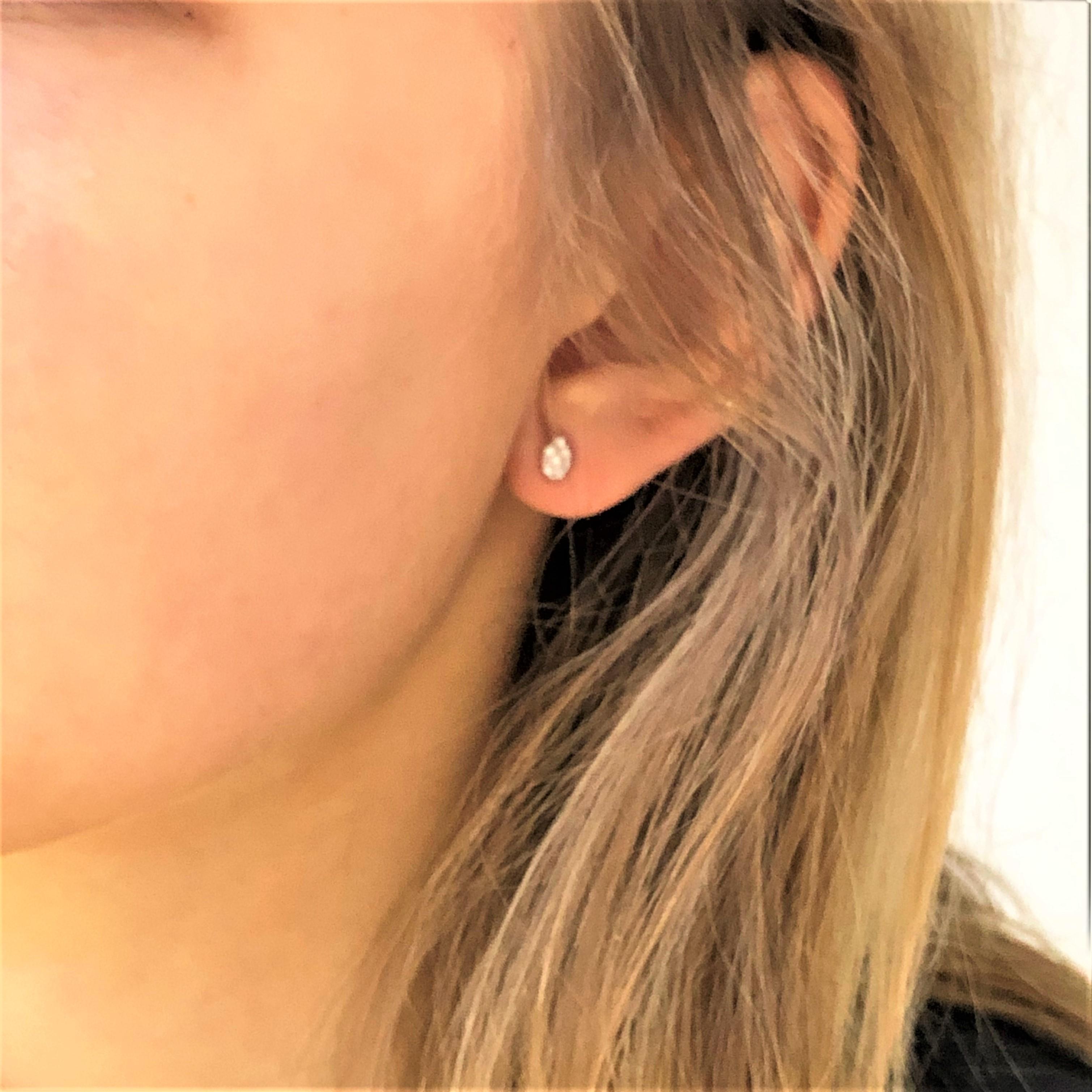 Round Cut Fourteen Karat Gold Pear Shape Design Diamond Stud Earrings Measuring 0.25 Inch 