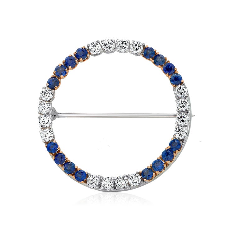 Round Cut Fourteen Karat White and Yellow Gold Diamond and Sapphire Circle Brooch Pin For Sale