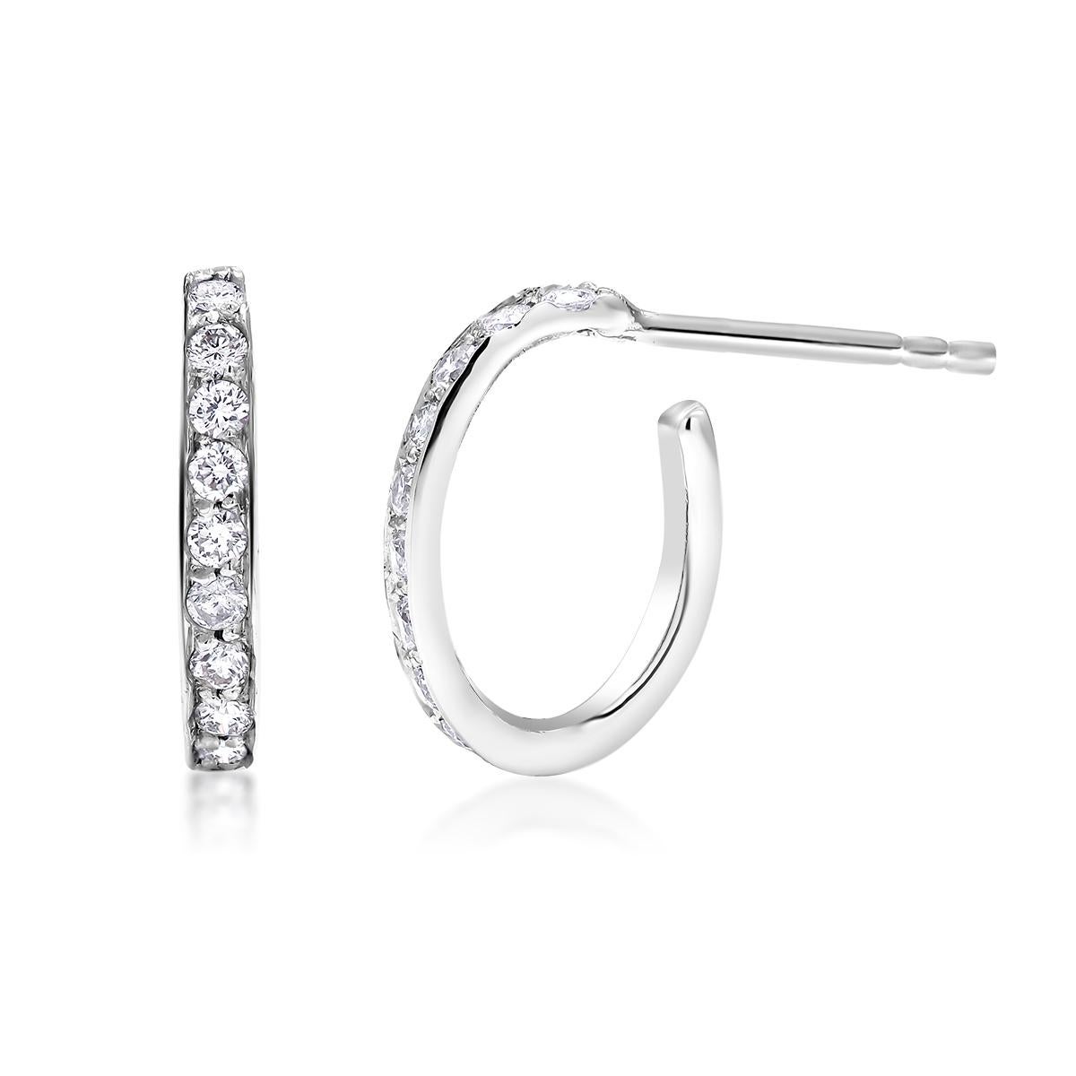 Fourteen Karat diamond mini hoop earrings
Earrings measuring 0.35