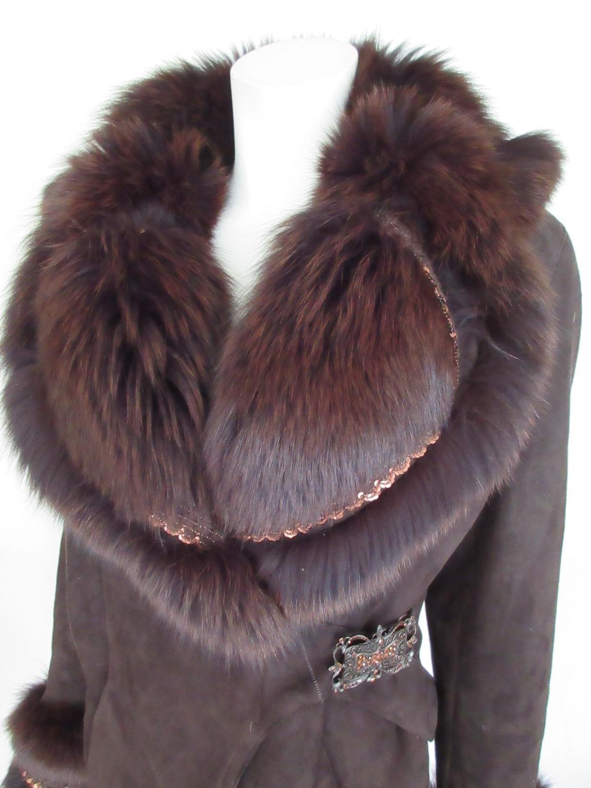 This jacket is made of soft brown tuscany lamb shearling with fox fur

We offer more exclusive fur 
/winter items, view our frontstore.

Details:
Made of brown soft quality shearling
with soft brown fox fur
embroidered with bronze color sequins
2