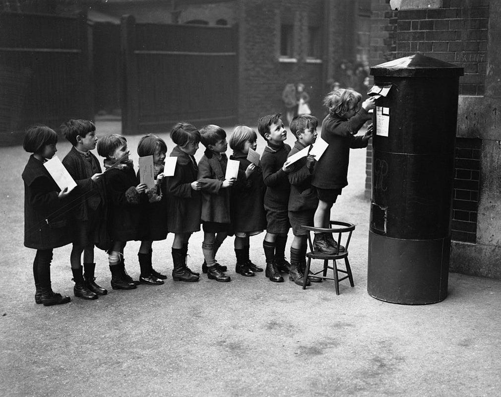"Post Queue" by Fox Photos

December 1926: Schoolchildren posting letters in the playground of the Red Lion Street School.

Unframed
Paper Size: 20" x 24'' (inches)
Printed 2022 
Silver Gelatin Fibre Print