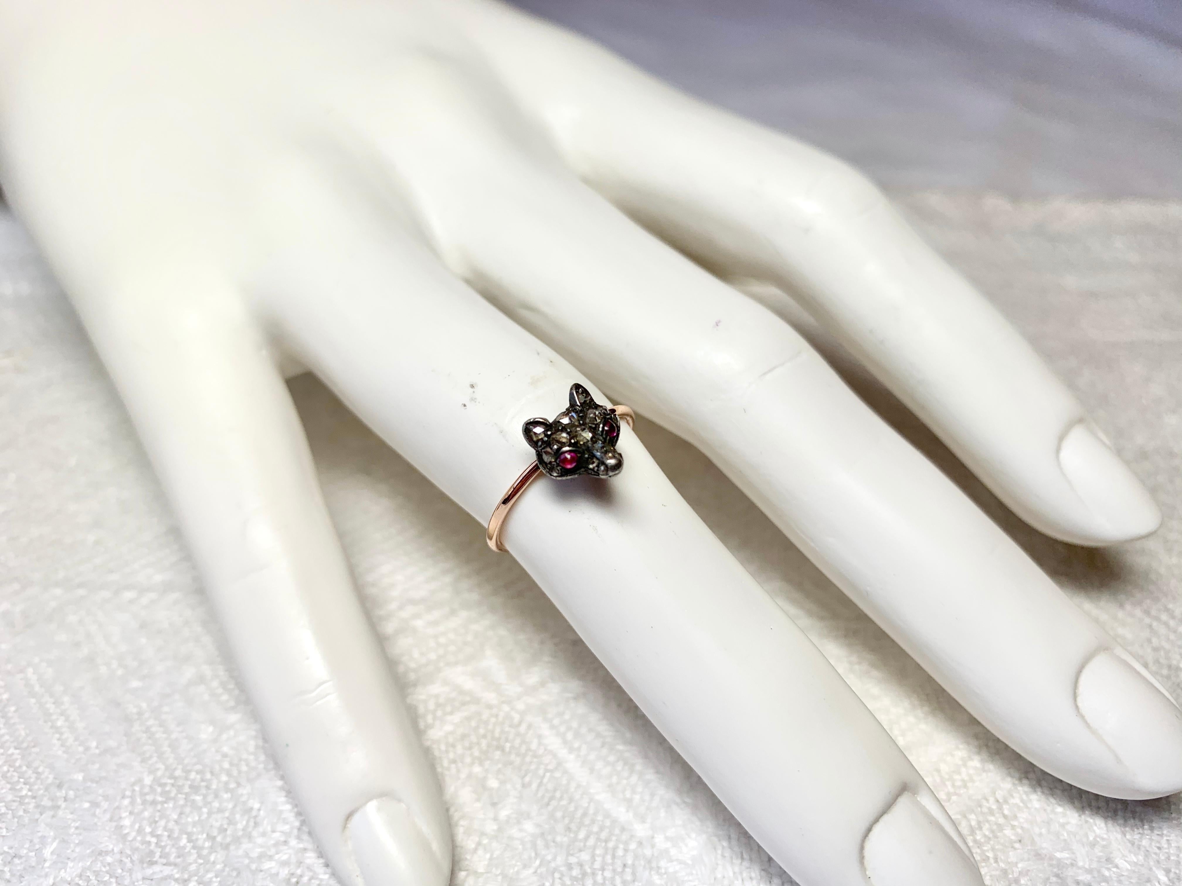 This is an Antique Victorian - Edwardian Ring with a gorgeous Fox head set with Rose Cut Diamonds with Ruby eyes.  The jewels are set in Silver atop Gold as was the custom of the period.  This is a very rare and wonderful antique animal fox ring. 