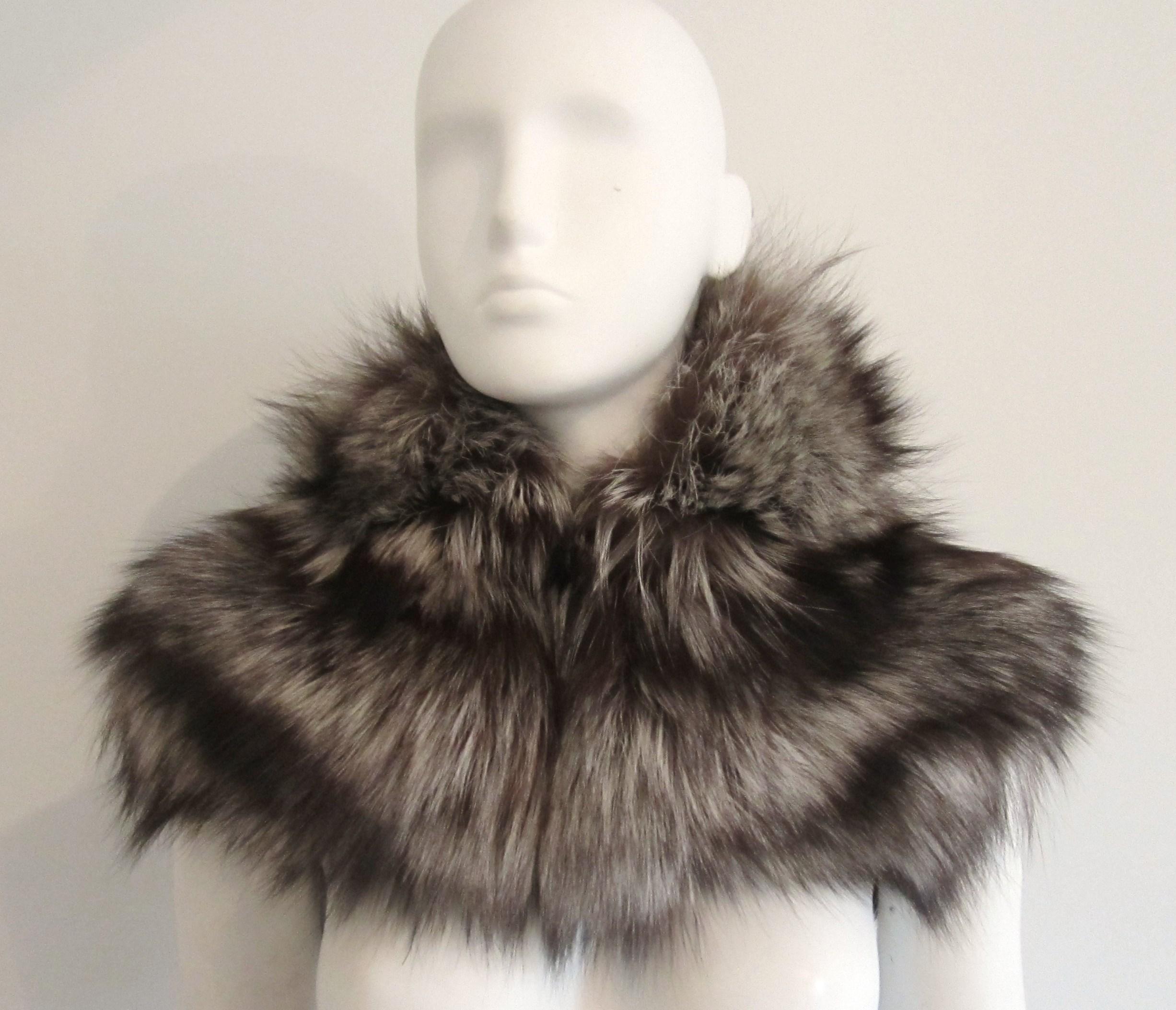 This piece is absolutely stunning. Soft and supple fox Capelet, shawl. Wear it over your coat for that added warmth and the WOW FACTOR! One size. 1 clip closure. Please be sure to check our storefront for more furs from Mink, Fitch, Fox and Lamb. We