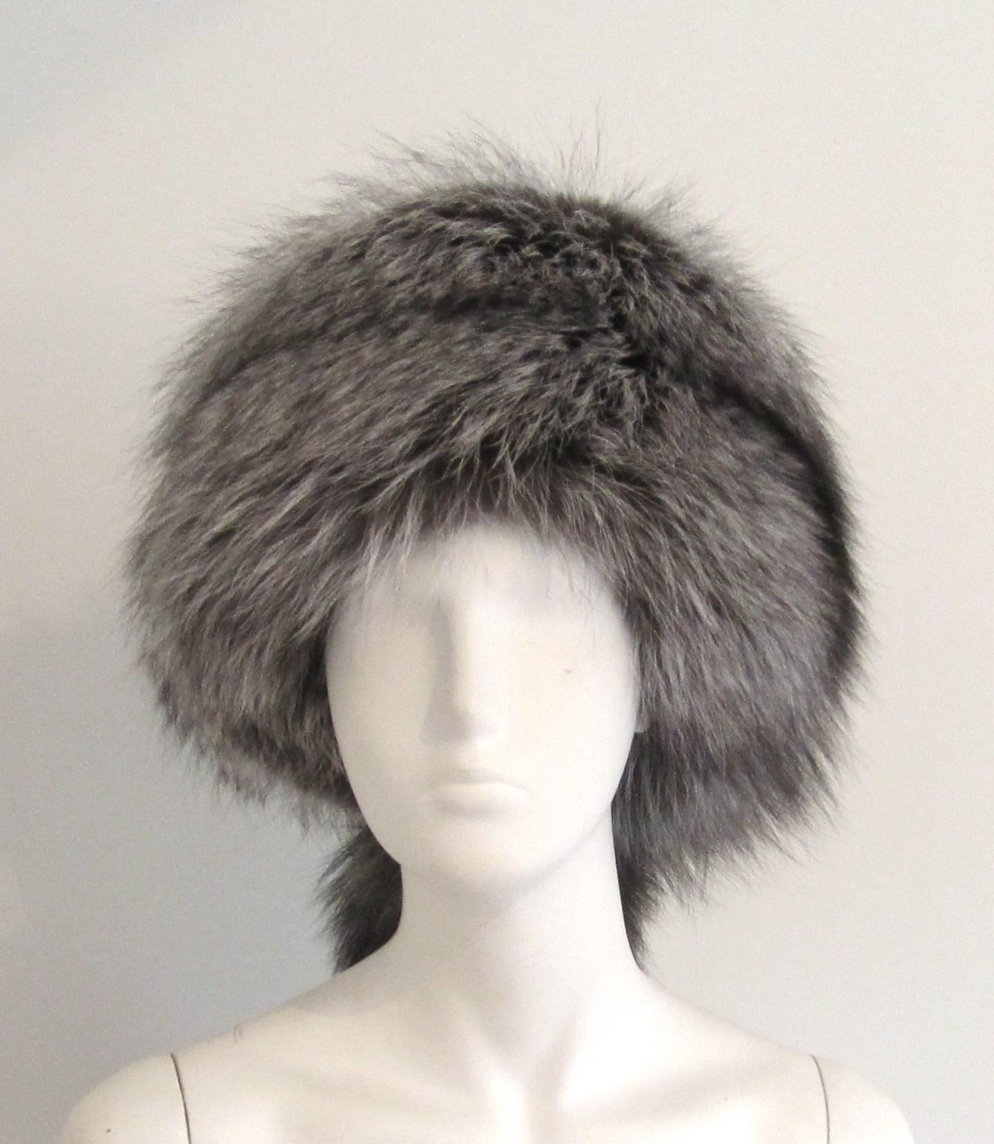 Fox Fur Trapper hat with a tail. This is a 22 in. This has a pull string inside to make it smaller if need be. We have more fox hats listed.  Please be sure to check our storefront for more furs from Mink, Fitch, Fox, and Lamb. We also have hundreds