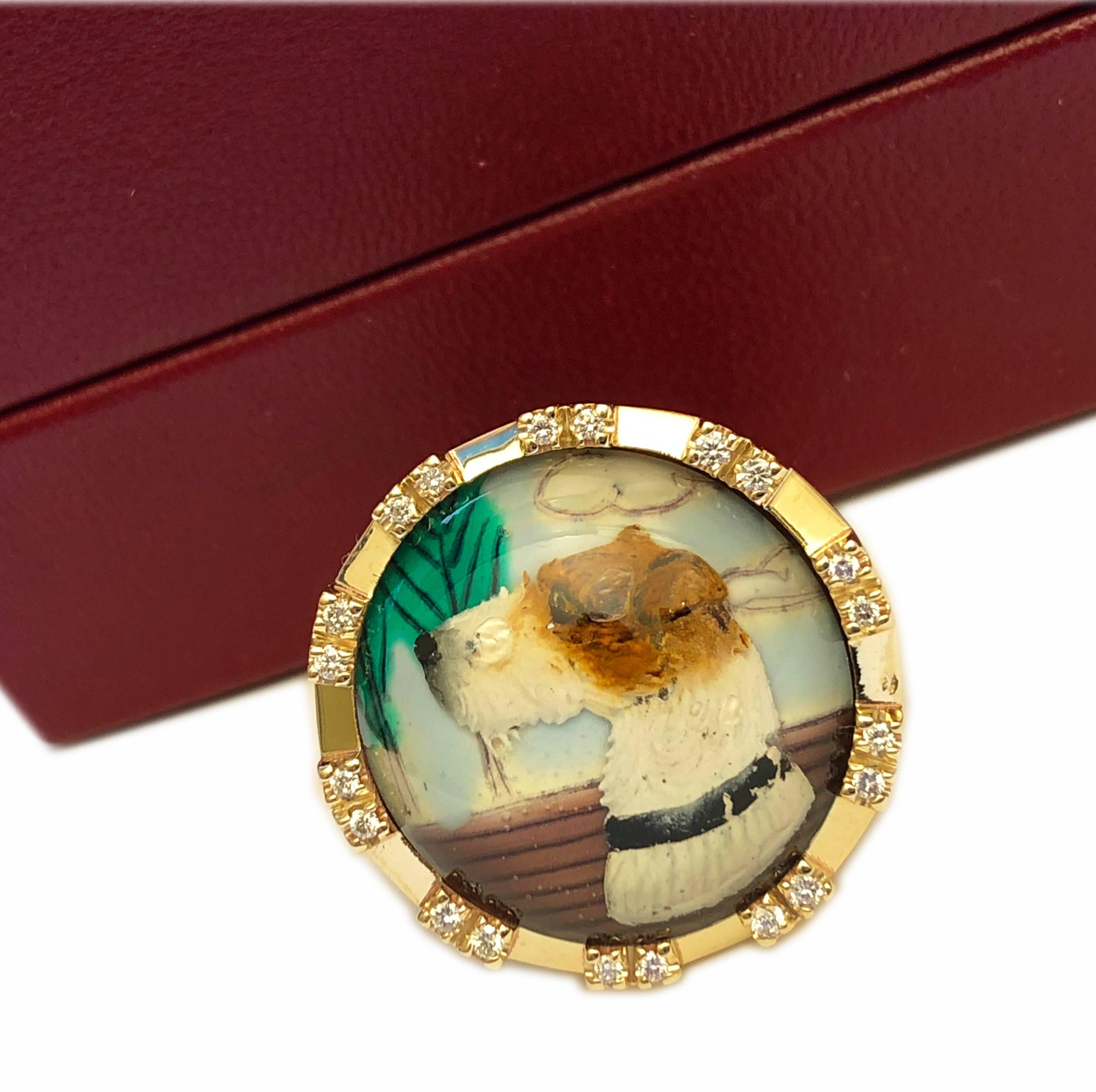 Essex Glasses or Reverse Painting Under Crystal featuring a Fox Terrier in a 0.22Kt diamond and yellow gold signet or cocktail ring setting.
The multicolor, vivid painting creates an unusual three-dimensional effect.
Giovanni Berca loved Essex
