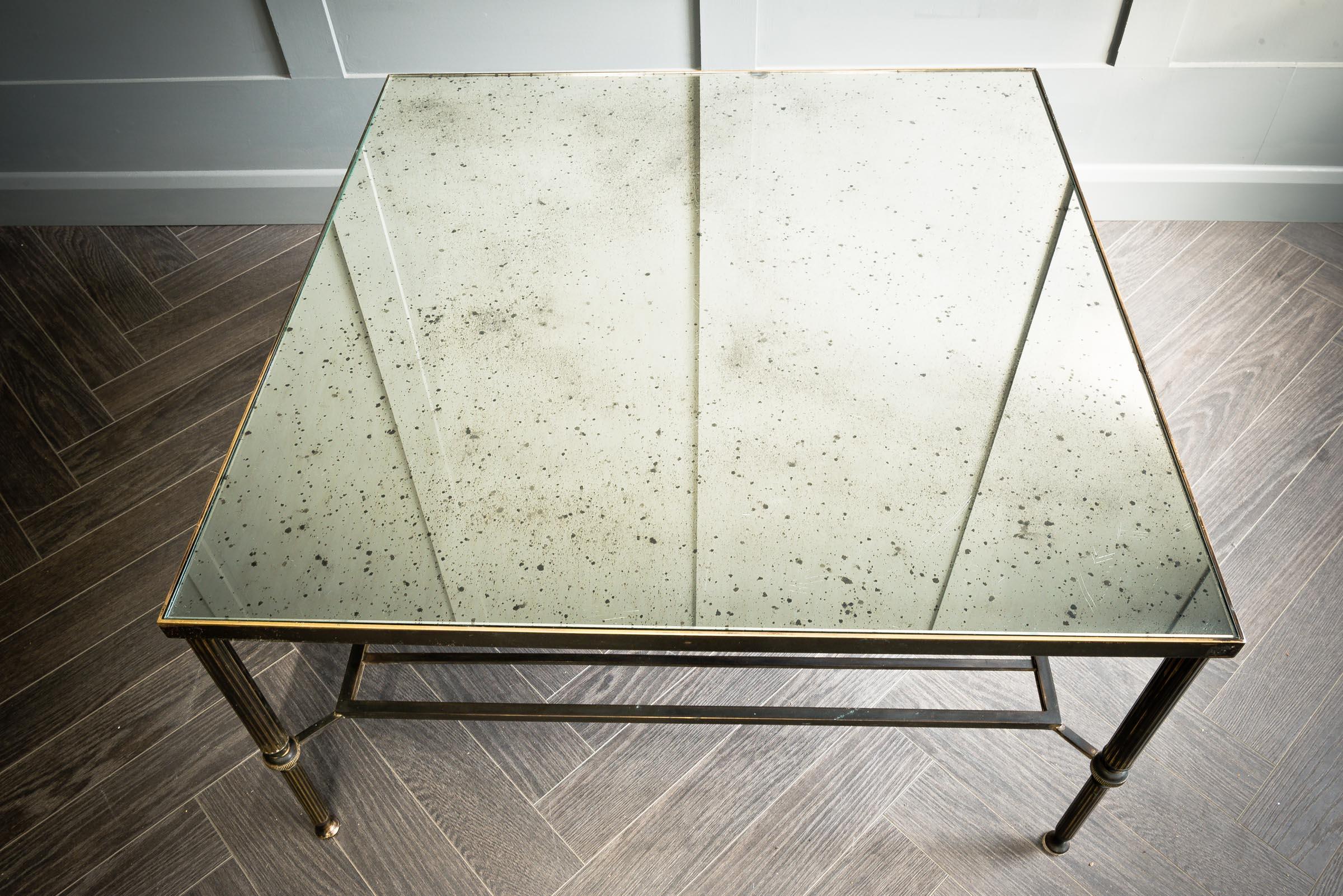 Foxed mirror top coffee table.