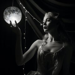 Blonde woman holding an Orb aloft