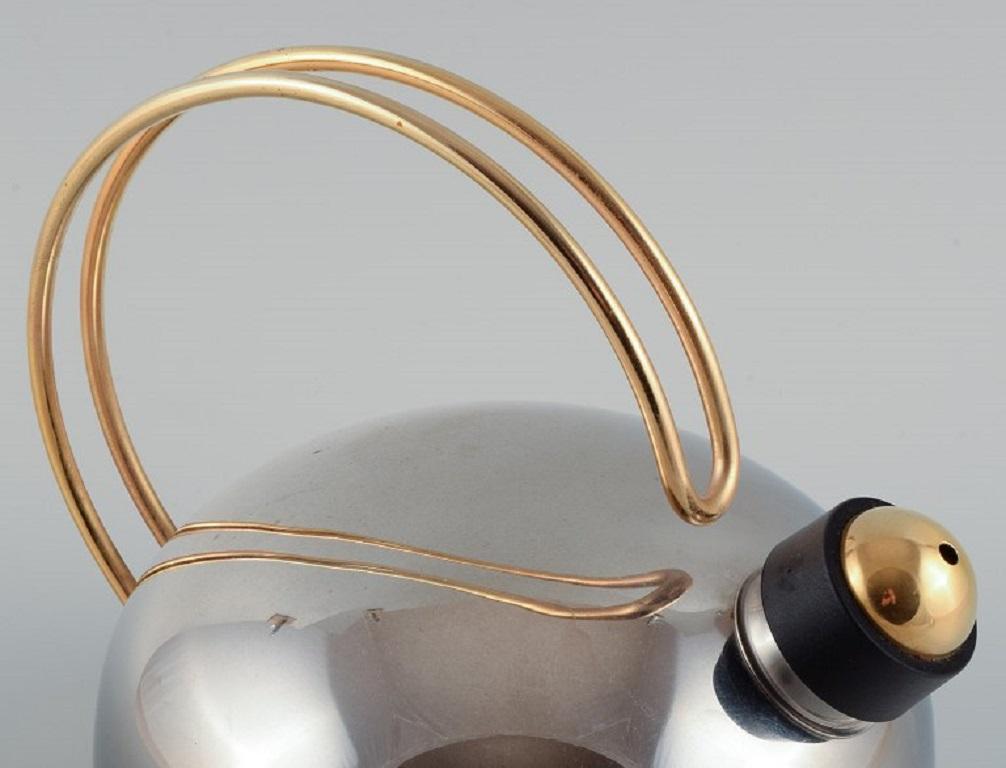 Italian Frabosk, Italy, designer kettle in stainless steel and brass. Late 1900s.