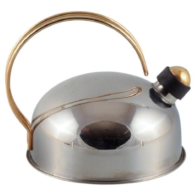 Frabosk, Italy, designer kettle in stainless steel and brass. Late 1900s.