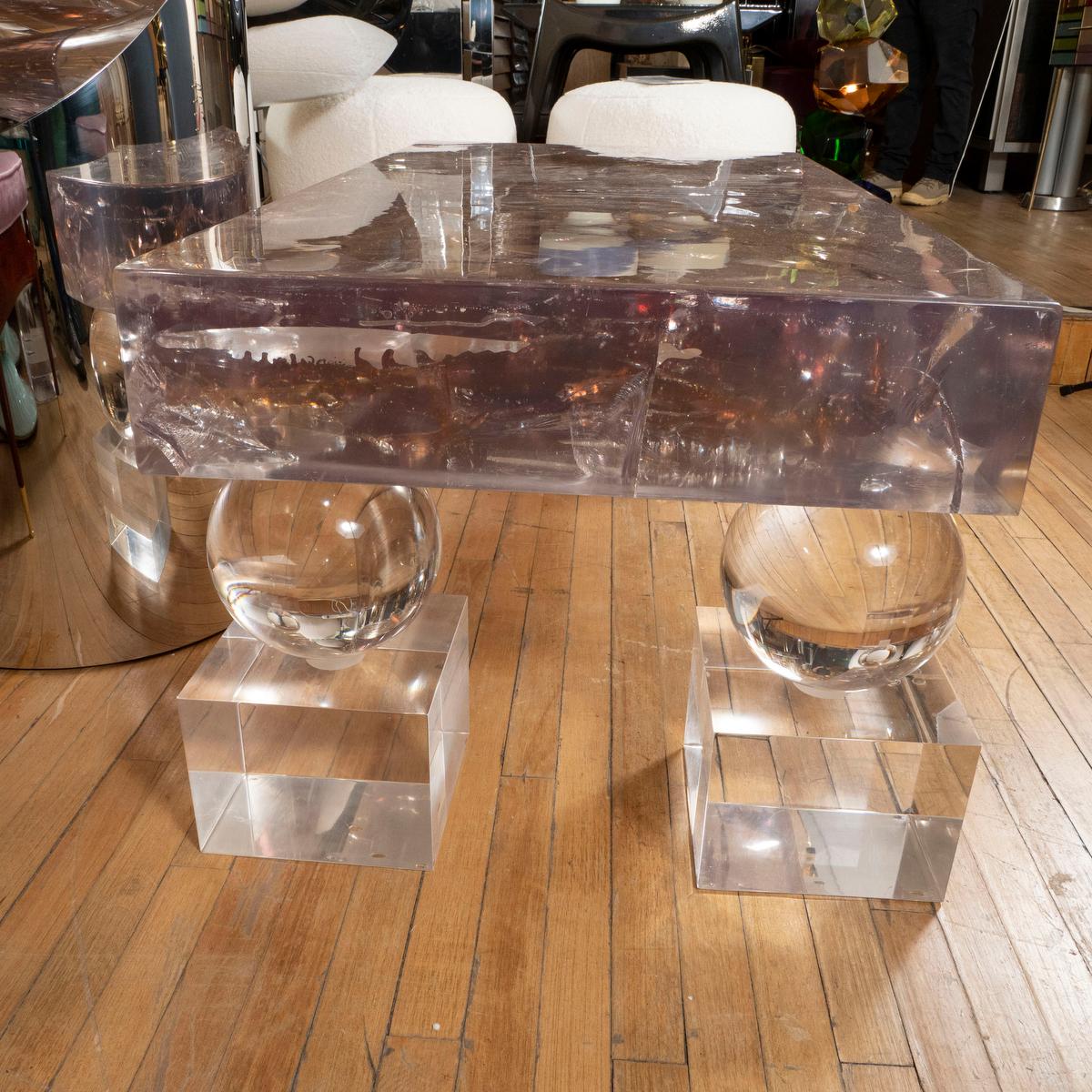 Fractale resin rectangular coffee table with clear Lucite geometric form bases.