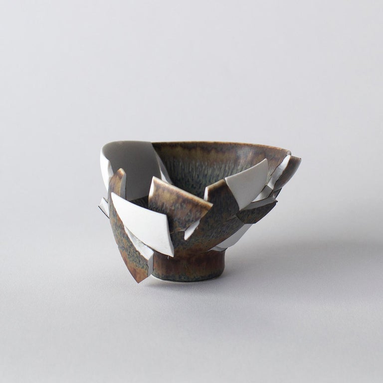 This series is made up of some glass and some ceramic works. These works are highly unique form and looking. Norihiko Terayama created them from damaged vases,coffee cups and so on. He start breaking damaged object into some fragments. Some of