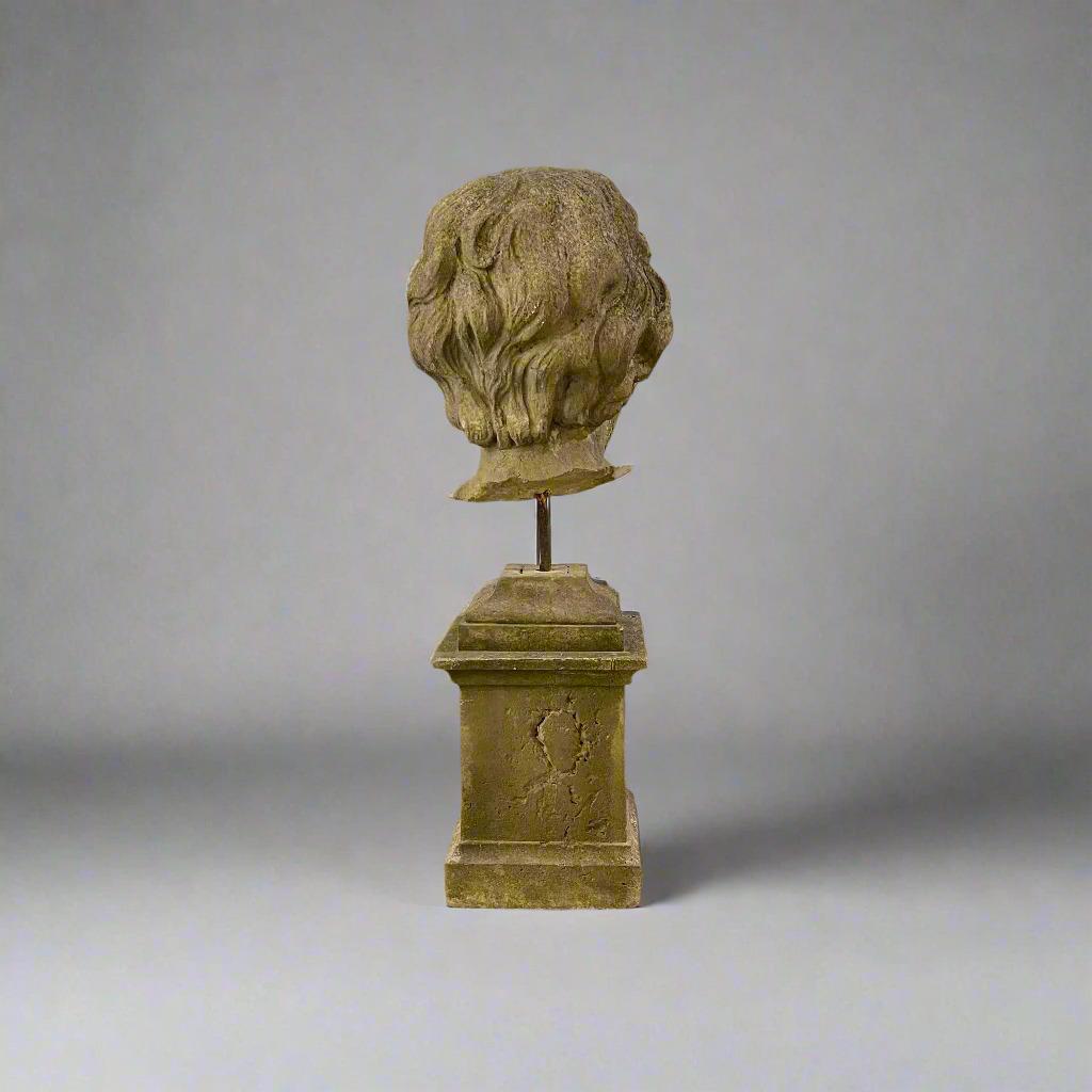 A lovely sandstone fragment, the head of a Putti is an 18th-century German artifact. Beautifully craved, the sculpture showcases the delicate artistry and timeless elegance of the era.  The carved neoclassical sandstone base is also18th century and