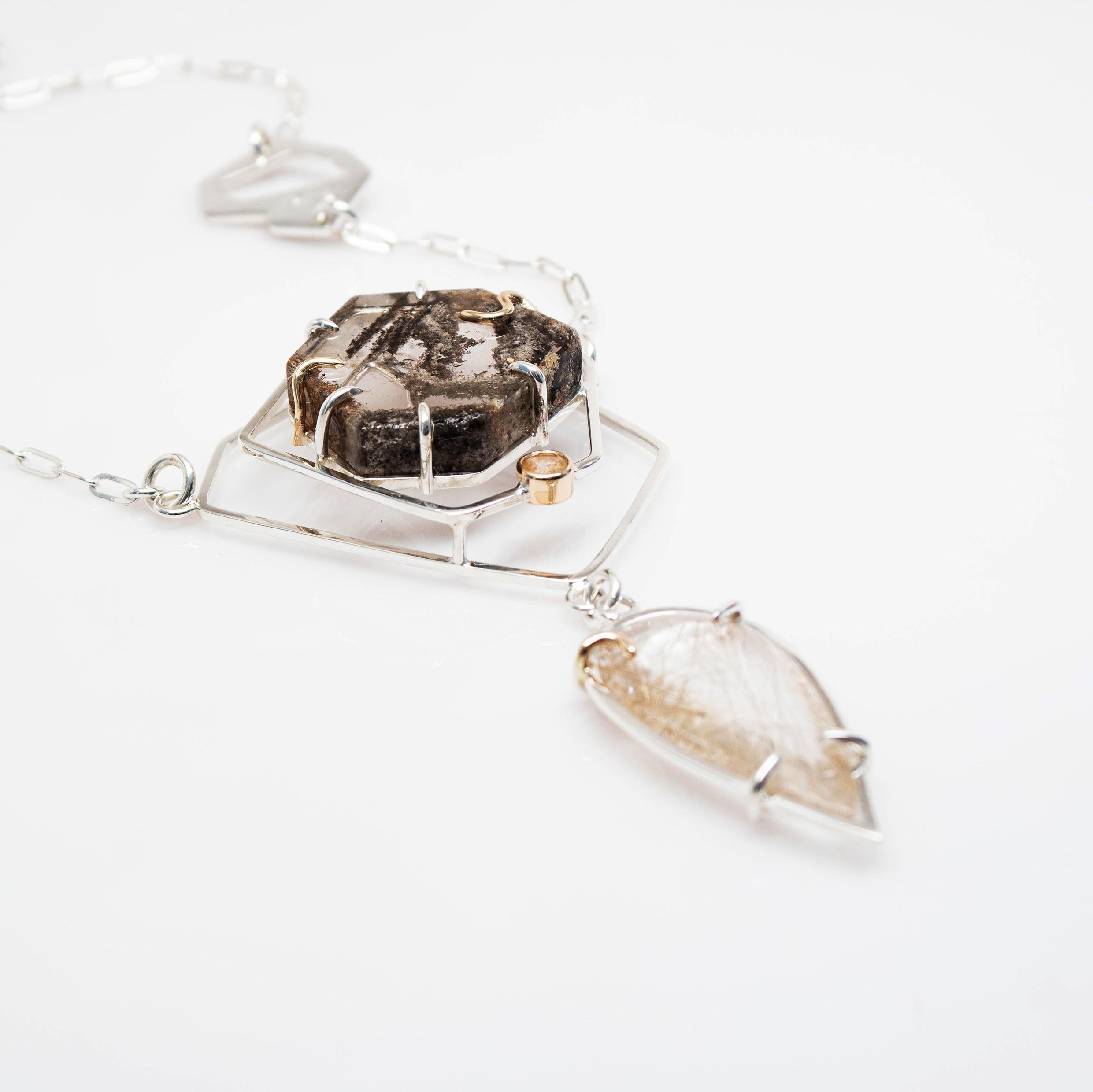 The Fragmentation Necklace was designed with crystal healing and balance in mind. The visual elements of this three-dimensional statement piece is a reflection of the beautiful complexities of what it means to be a spiritual being having a human