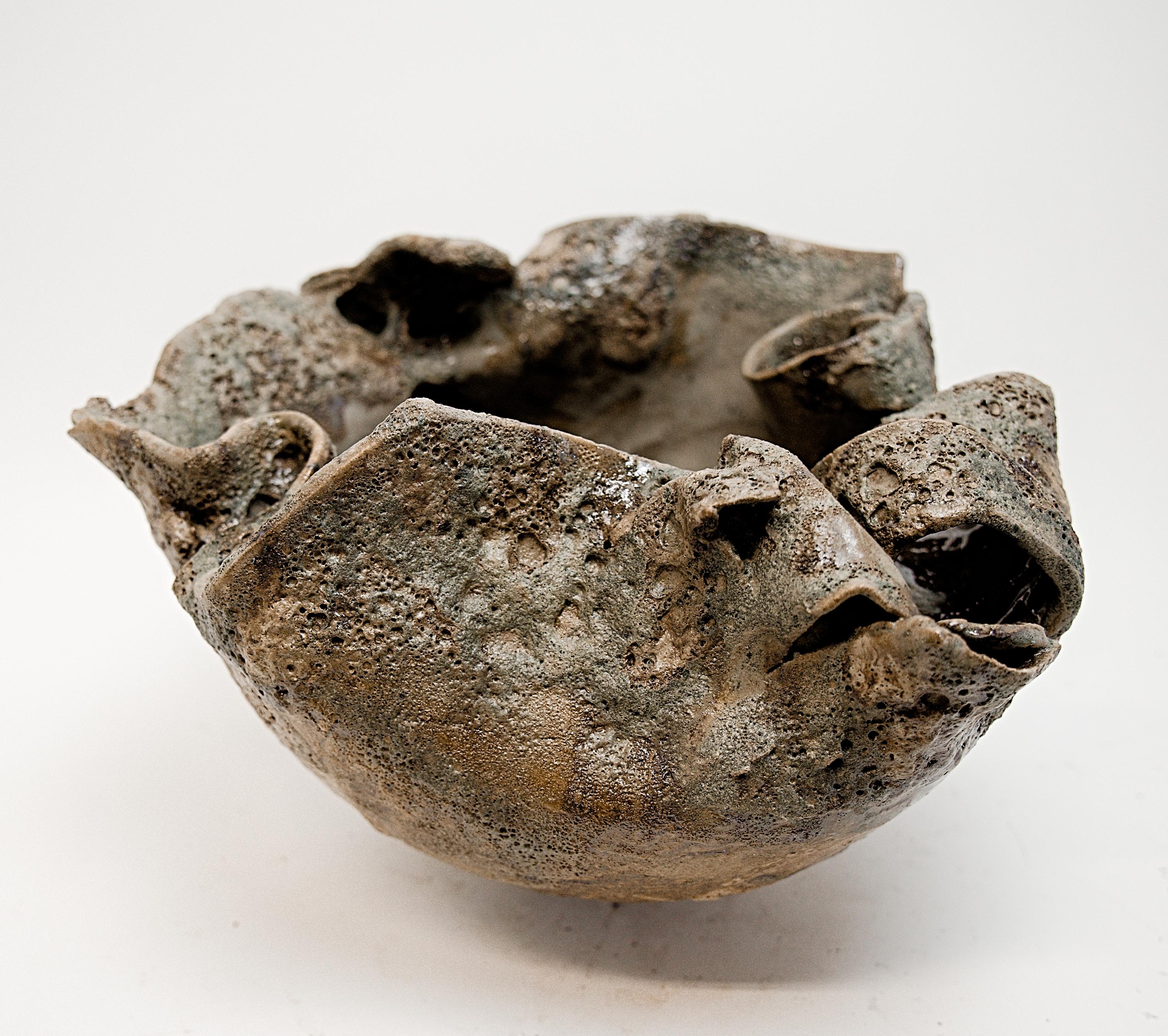 Found like an ancient relic.. created from found clay slabs throughout the studio.
Glazed and finished in old world green matte glaze mix of color and texture .
 
 
 
 
This hand made ceramic vase or bowl for interior design showcases a stunning