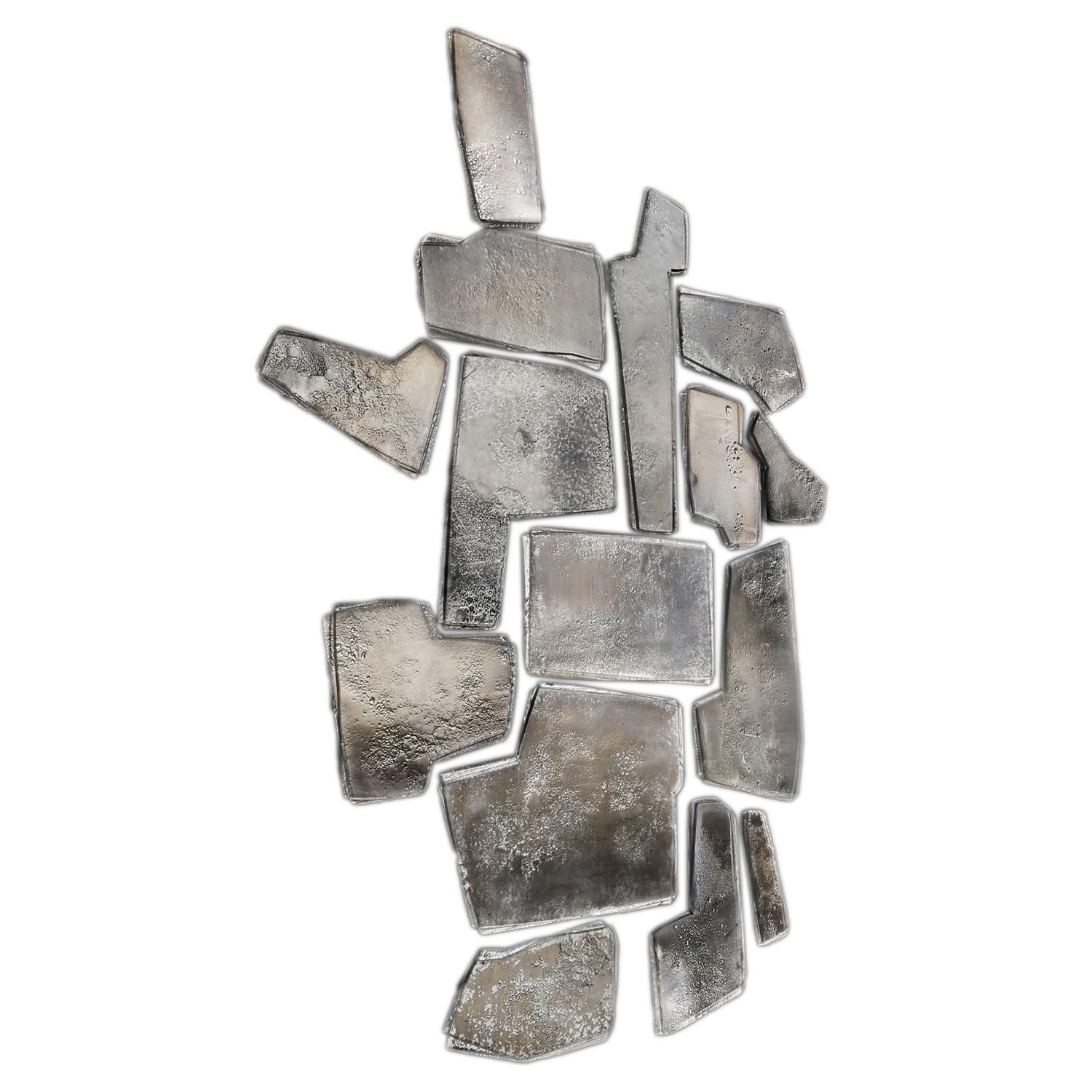 Wall Decoration Fragments Silvered composed of 15 fired 
glass parts in two layers, with irregular edges, each part
with wooden structure in matte lacquered finish at the back 
and front in silvered fired glass with medium antique finish.