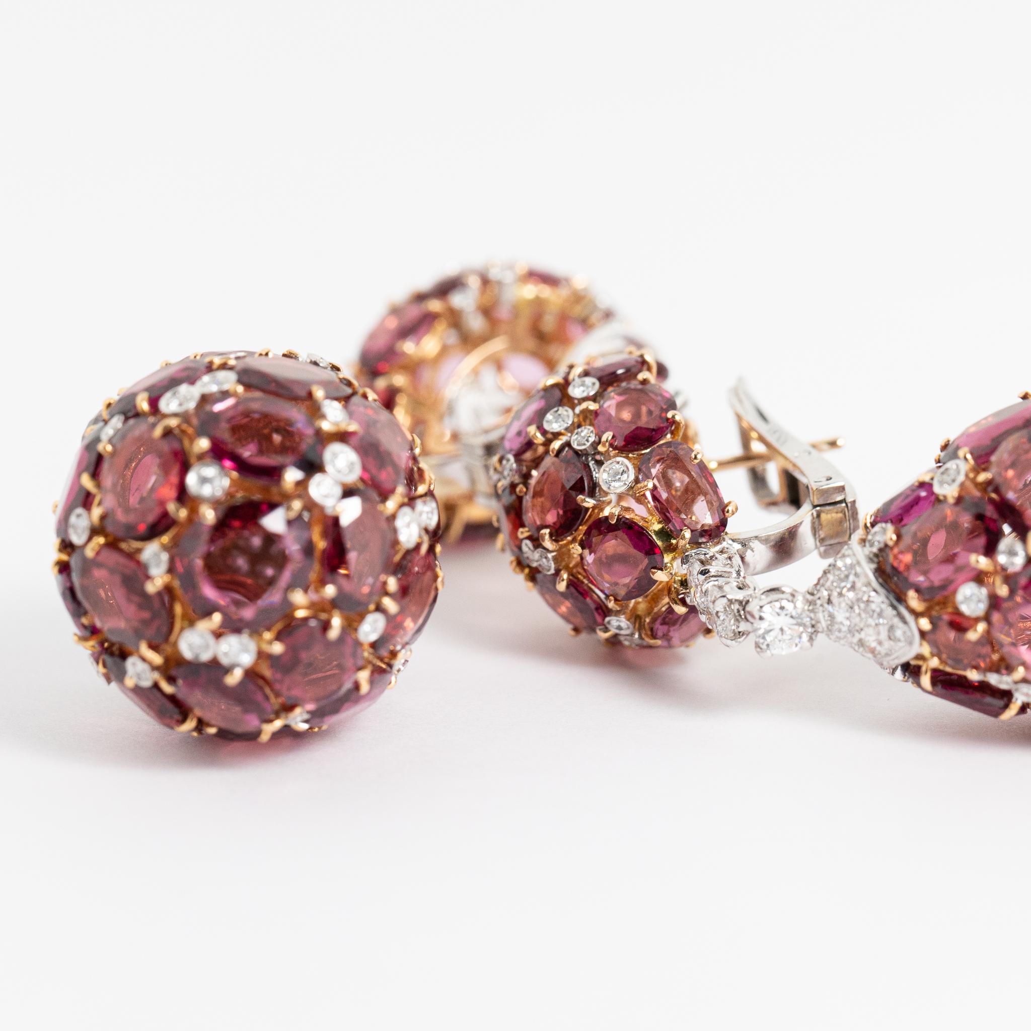 Earrings made of 18 kt. white and rose gold with diamonds and rhodolites.
These one-of-a-kind earrings are designed as two drops connected by a diamond trilogy.
Entirely made in Italy, one of a kind.

Round-cut diamonds: ct. 3.49 ( H-I color /