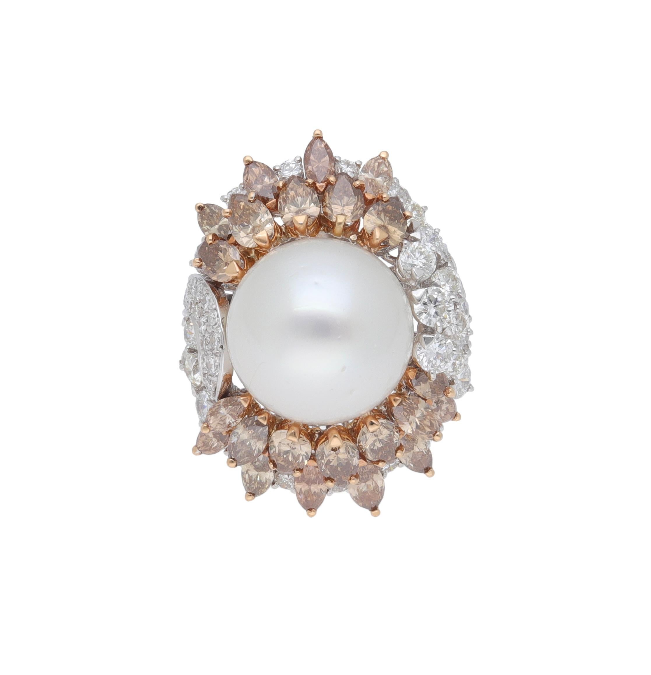 Handcrafted ring made in Italy of 18 kt. white gold with brilliant-cut diamonds, brown navette-cut diamonds, Australian pearl.
This ring is part of the Moon Fraleoni Collection. 
Unique piece.
The 20 mm. Australian pearl is sandwiched between the