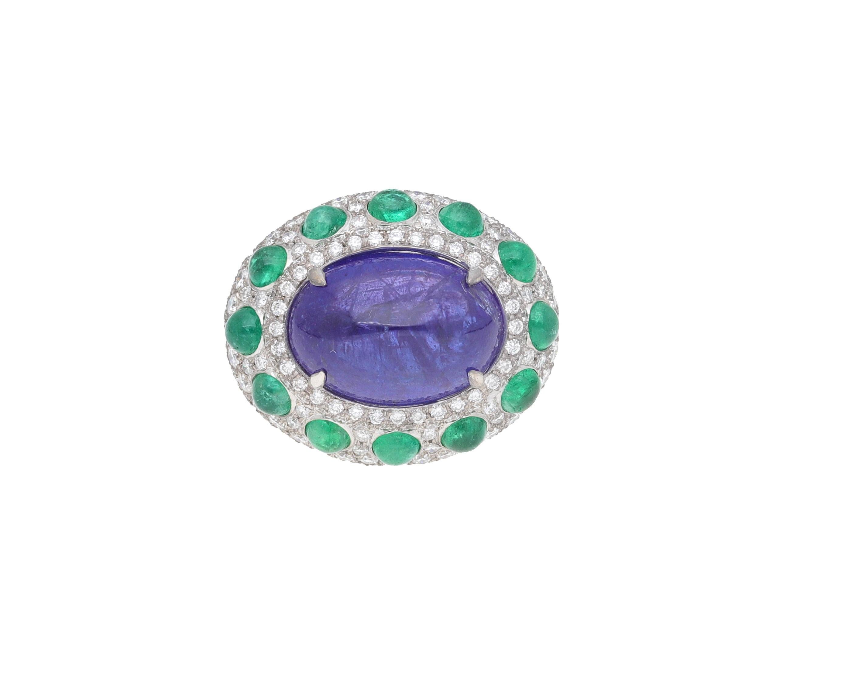 Handcrafted ring made in Italy of 18 kt. white gold with diamonds, emeralds and tanzanite.
This ring from the Queen Fraleoni Collection is made with a pavé of diamonds surrounding the central tanzanite cabochon.
Cabochon emeralds are inserted into