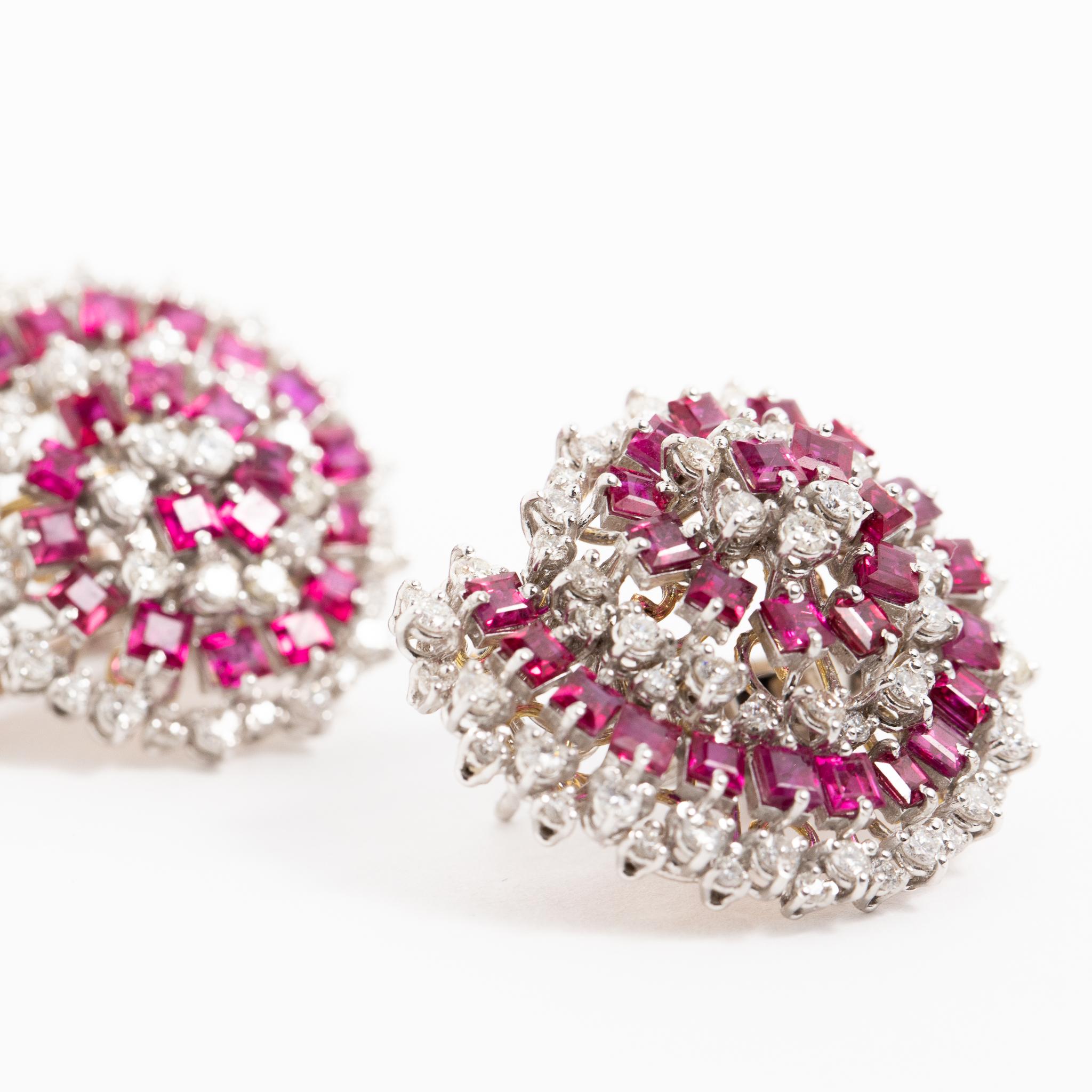 Handmade in Italy 18 kt. white gold earrings with brilliant-cut diamonds and carat-cut rubies.
This piece belongs to Fraleoni's Dolcevita collection.
The earrings have a spiral design where the colors of the stones blend perfectly.

Brilliant-cut