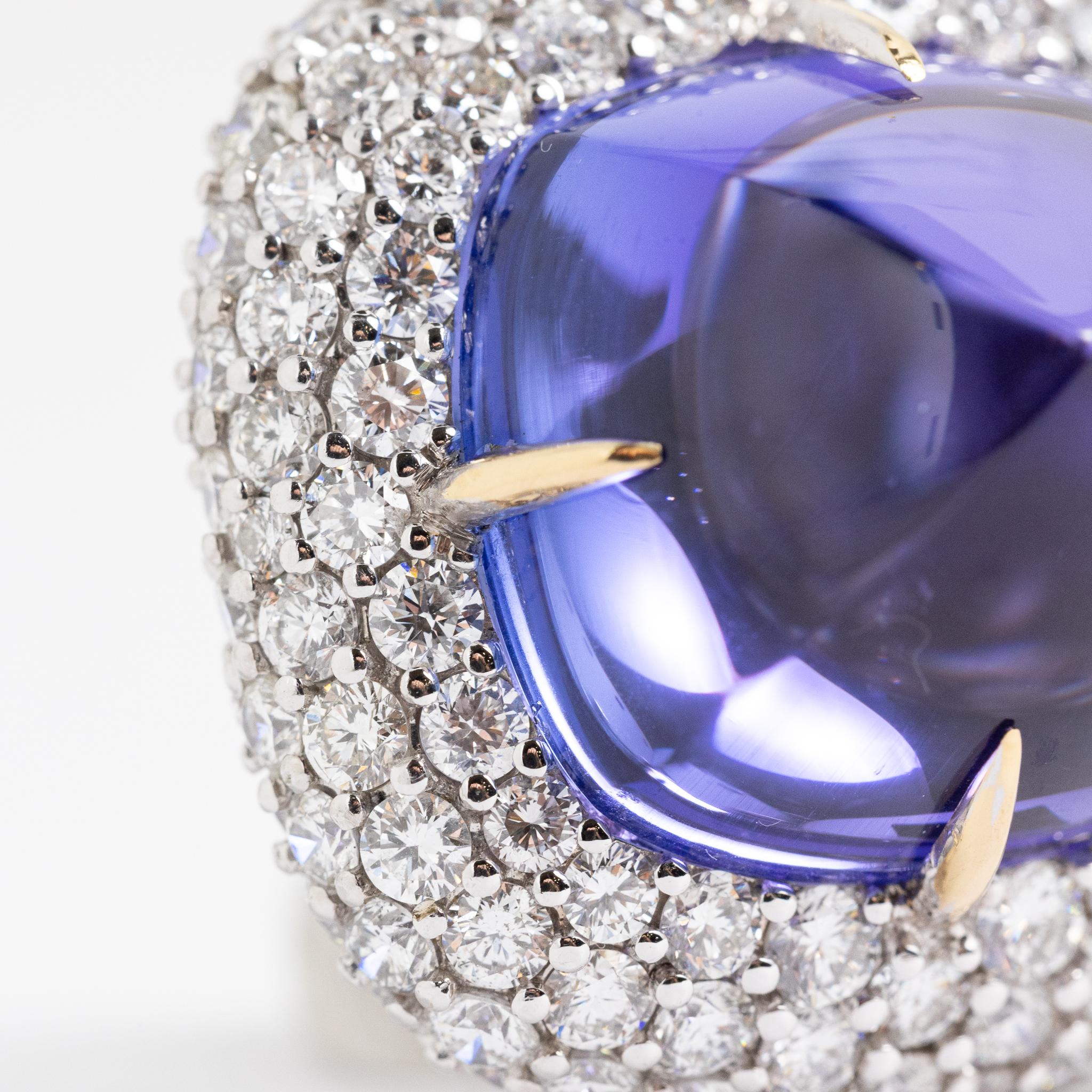 Handcrafted ring made in Italy of 18 kt. white gold with diamonds and tanzanite.
This piece is part of the Diamond Collection  Fraleoni and is one of a kind.
The setting is made with pavé diamonds surrounding sugarloaf-cut tanzanite.
2015

Round-cut