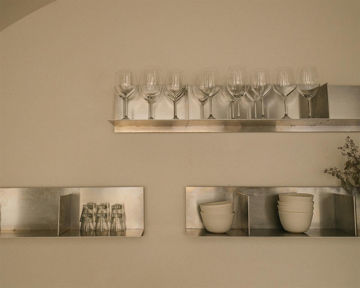 The Rivet Shelf explores basic storing facets within one shape while functioning as a storage and display platform.

The Rivet design is a symbiosis between craftsmanship and industrial production. Based on the traditional hand construction