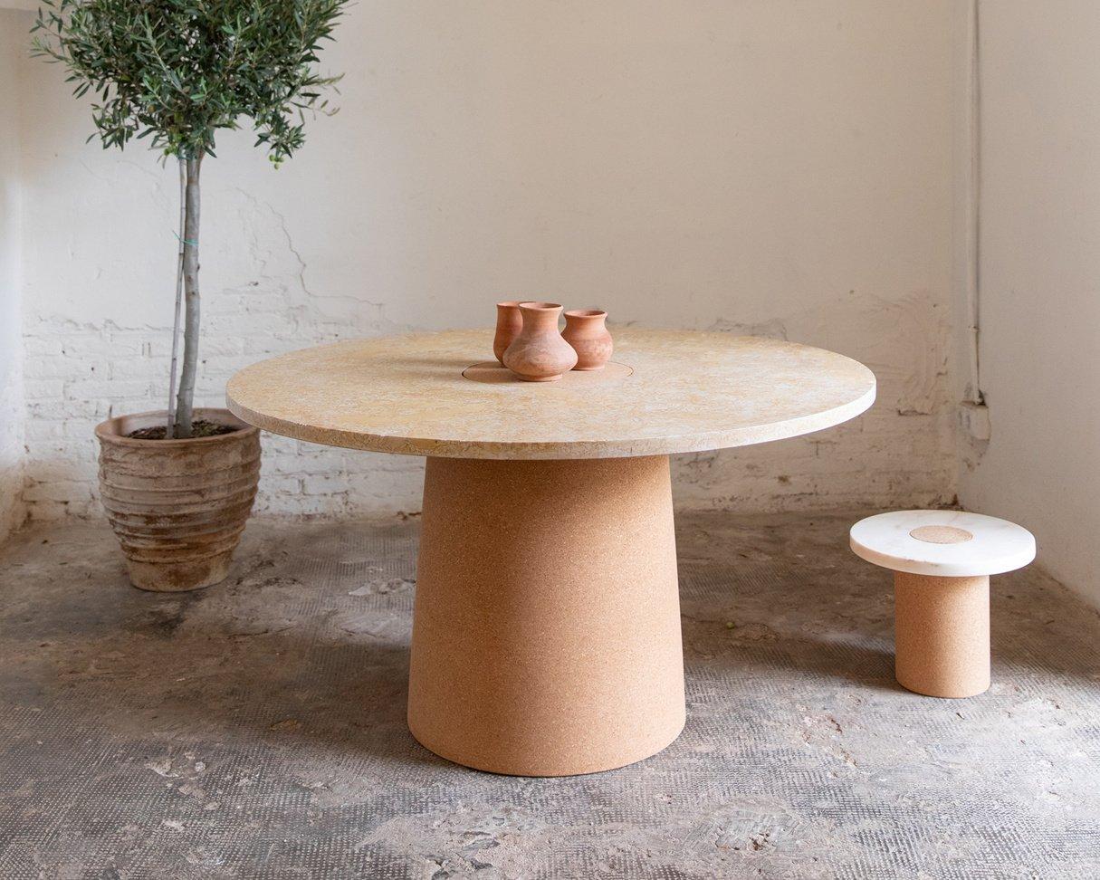 Suitable as a dining or meeting table where the contrast between the soft warm cork, meets the cold smooth marble. The distinction between the two shapes gives the impression of two worlds meeting one another.

Features
– Seats 5-7 people
–