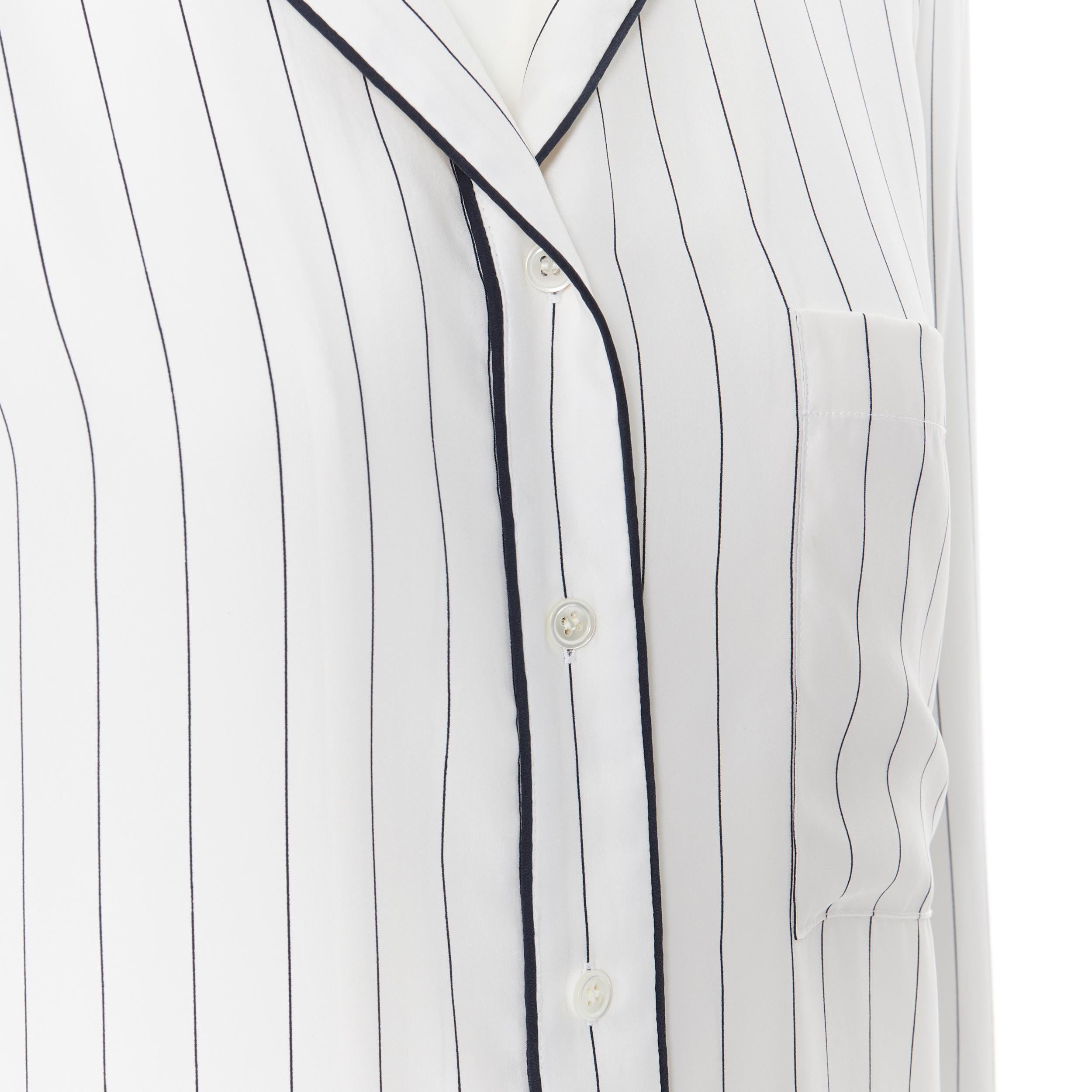 FRAME 100% silk white black vertical stripe black piping casual pyjama shirt XS
Brand: Frame
Model Name / Style: Silk shirt
Material: Silk
Color: White
Pattern: Striped
Extra Detail: 100% silk. Black piping. Button front closure. Long Sleeve.
