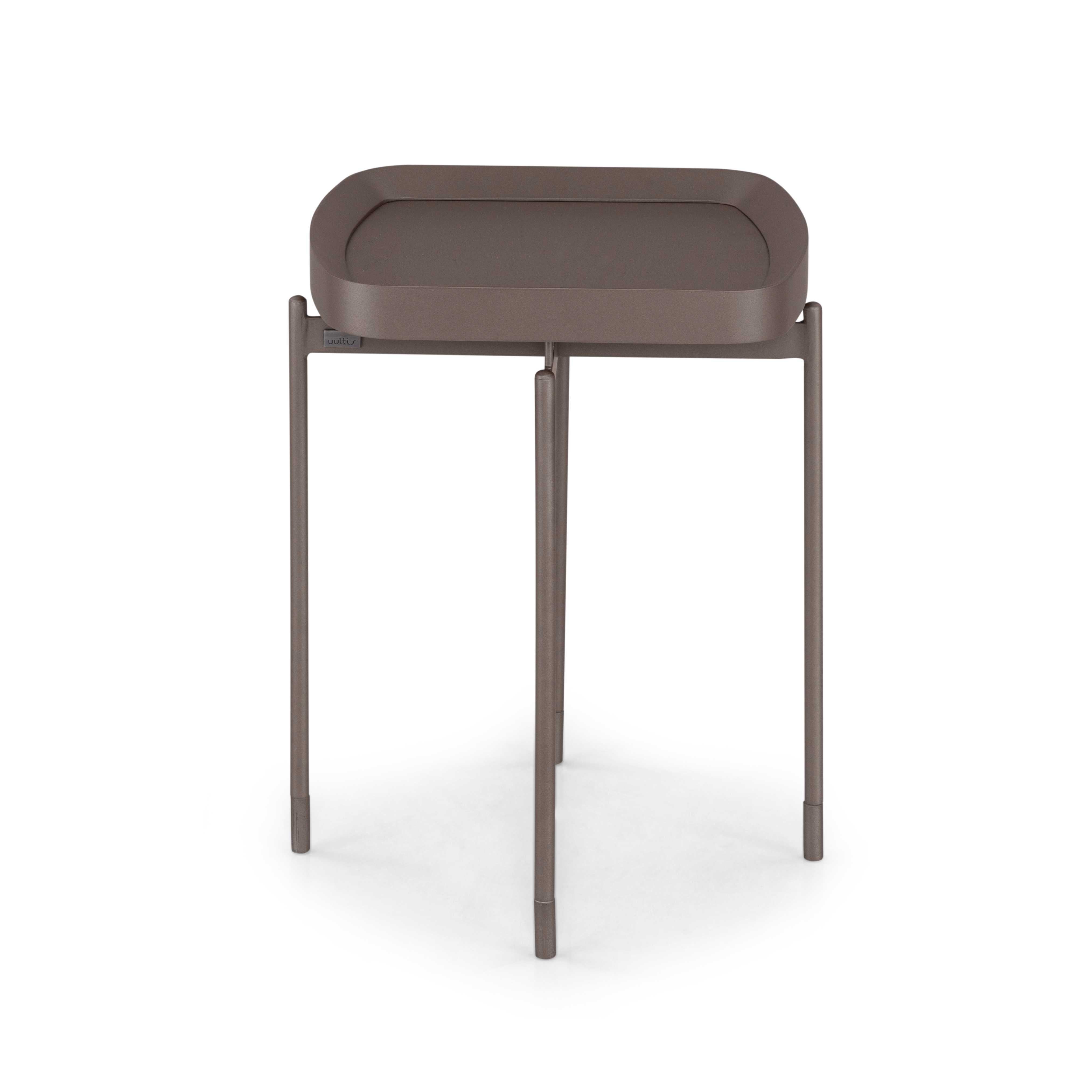 The Frame coffee table by Uultis is a refined expression of Brazilian design, merging architectural clarity with natural warmth. Crafted with a 17-inch square top in chocolate oak veneer, this table rests on a minimalist chocolate-toned metal