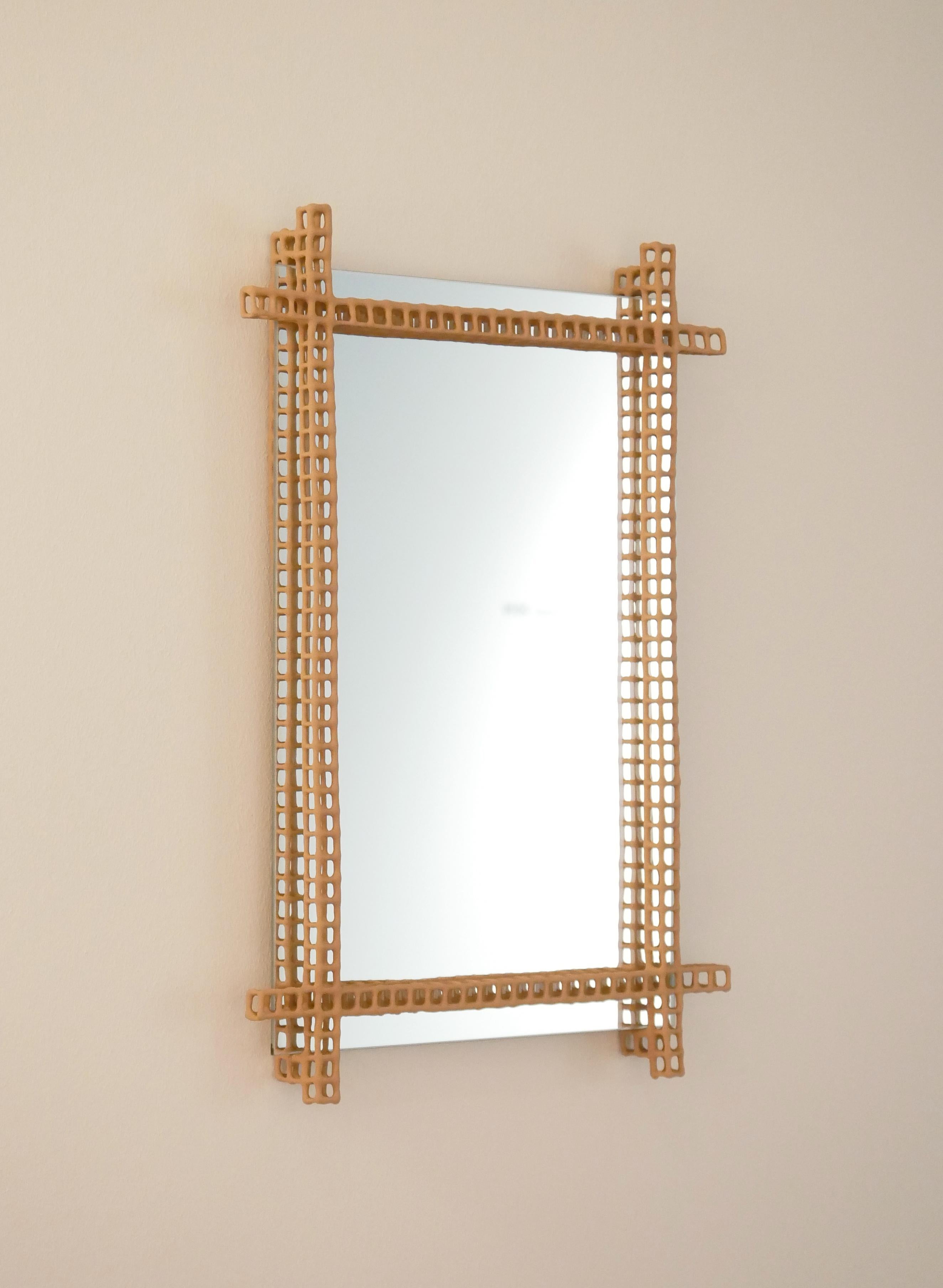 Frame Mirror by Dzovag Kotchian
Dimensions: W 39 x D 4 x H 51 cm
Materials: Stabilized Raw Clay, Metal, Mirror. 

Dzovag Kotchian's work develops through theoretical reflection and artistic research. Experimentation with materials, uses and