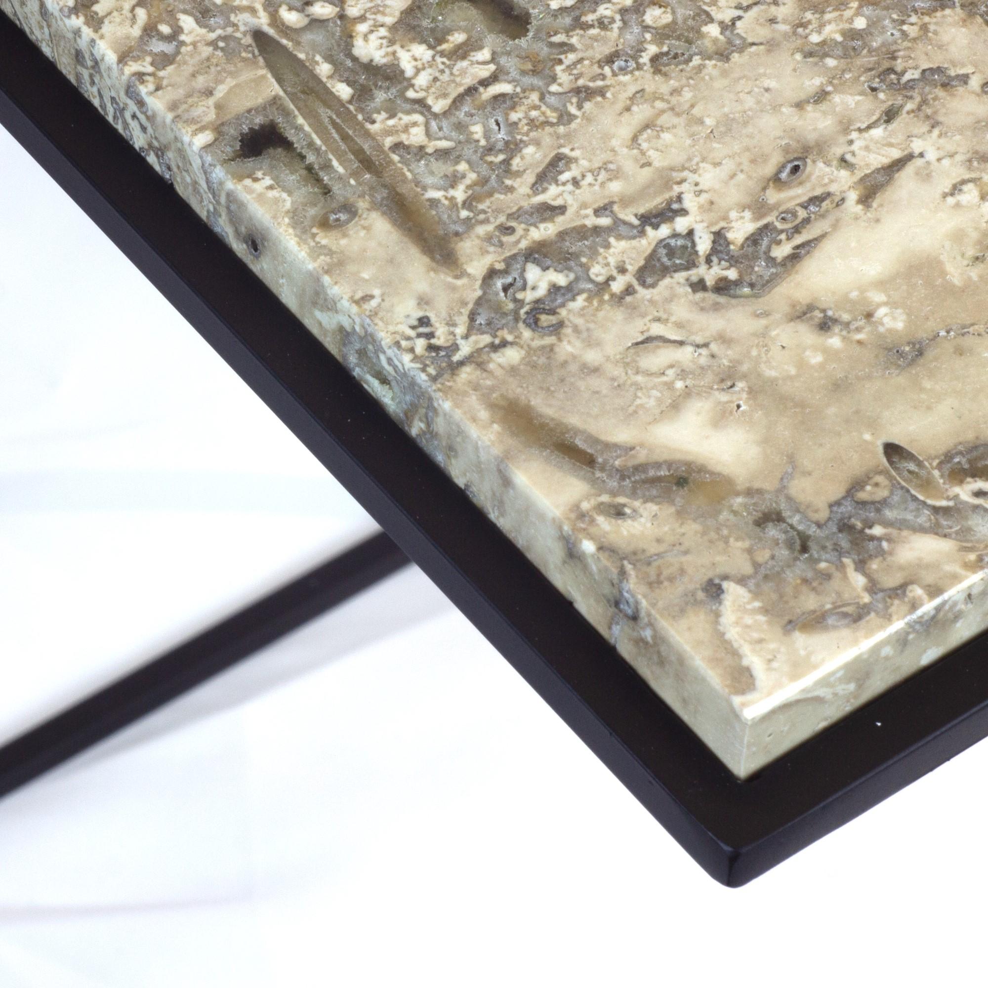 Elevate your interior with FramE, a side table that masterfully combines art and utility. Designed to showcase the unparalleled beauty of its marble or stone top, FramE transforms functional furniture into a statement of sophistication.

The table’s