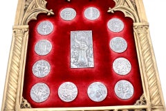 Frame with silver medals alluding to Saint Anthony
