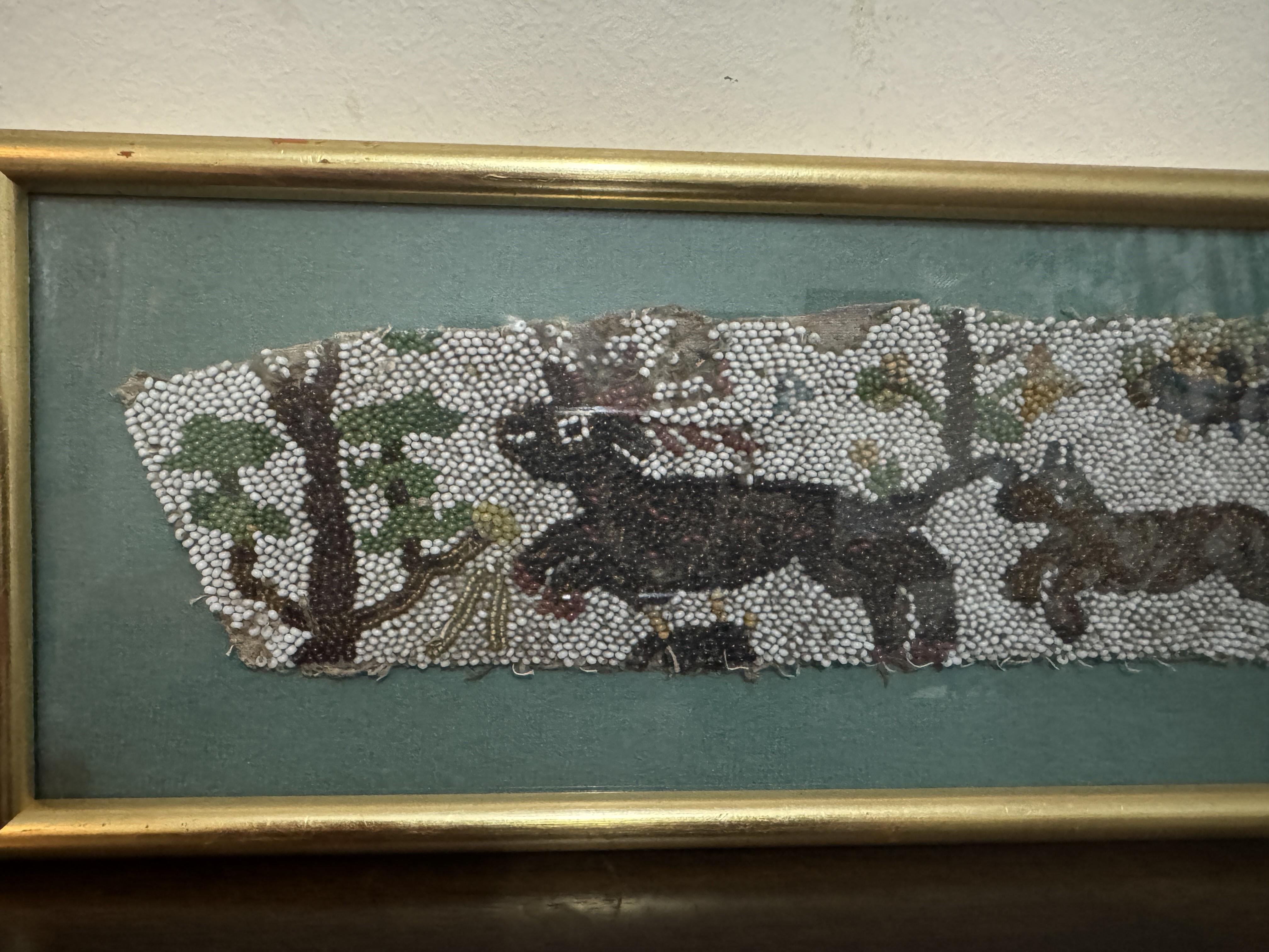 A Charles II Beadwork Fragment, circa 1650. Depicting a huntsman, with a horn and staff, directing a dog in pursuit of a deer. Various trees and forest animals in the background,

Framed and glazed in UK around 1970's, dealers stamp on the reverse.