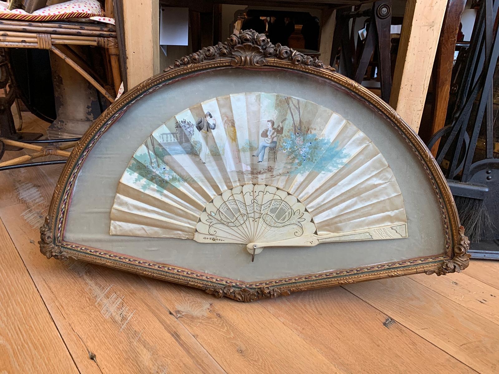 18th-19th century hand painted silk fan with mother of pearl handle in glass and giltwood display case / frame with stand.