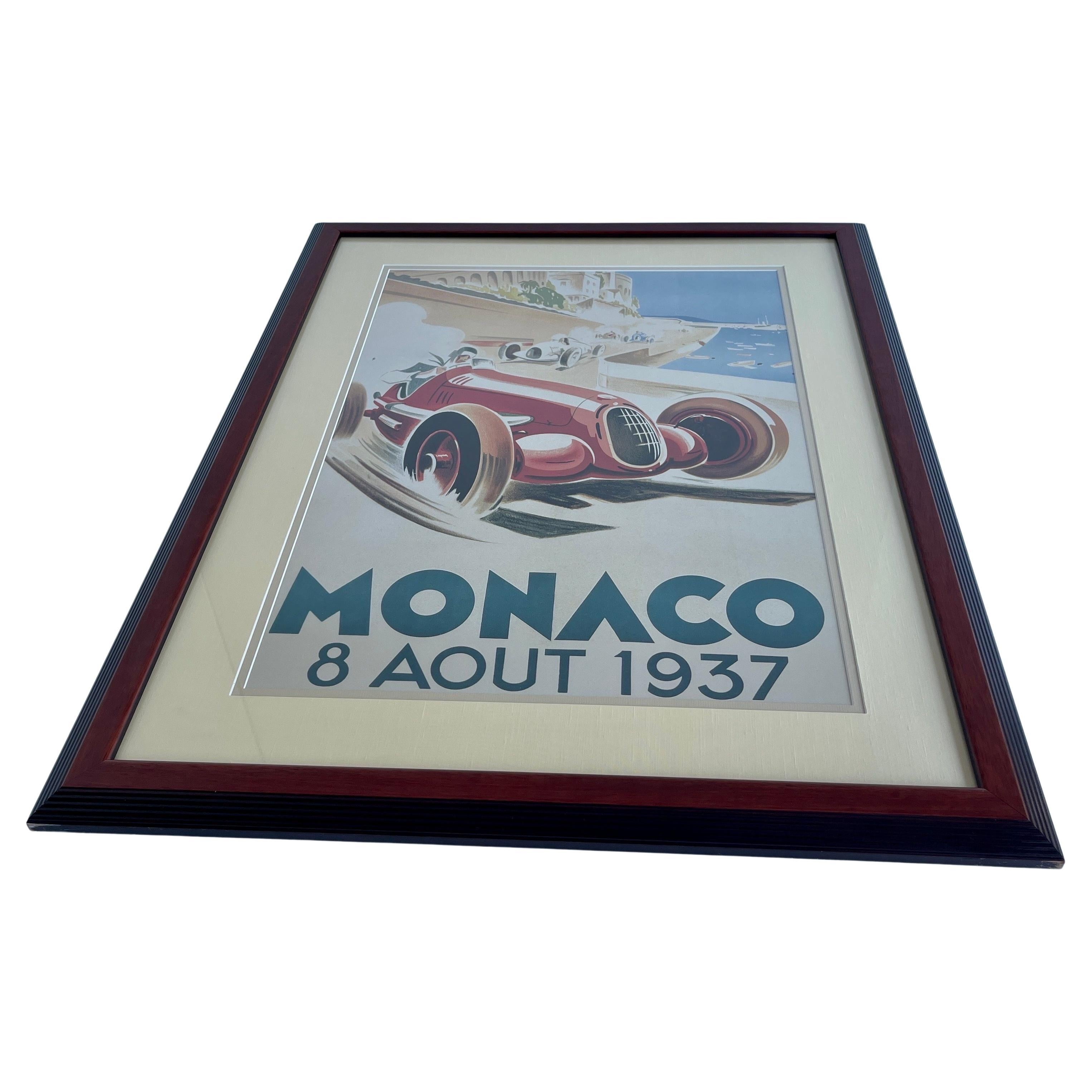 Beautiful framed poster of the August 8th 1937 Grand Prix de Monaco. The poster is a later reprint, probably from the 1980's. The poster is installed in a double matted installation, with the outer larger matte in in a light linen fabric. The