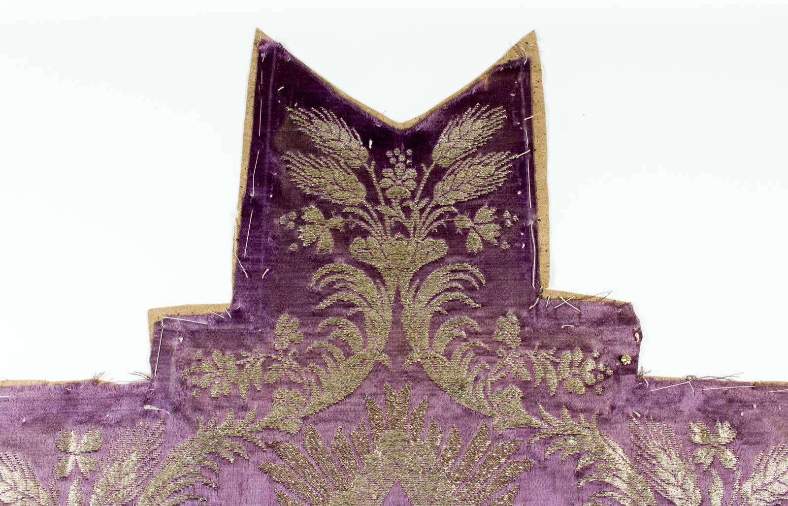 This beautifully made antique (late 1800s) religious textile fragment shows a metallic purple cross with gold, silver, and many other colors of embroidery, was uncovered recently in France. We had it framed in a very simple metallic frame which is a