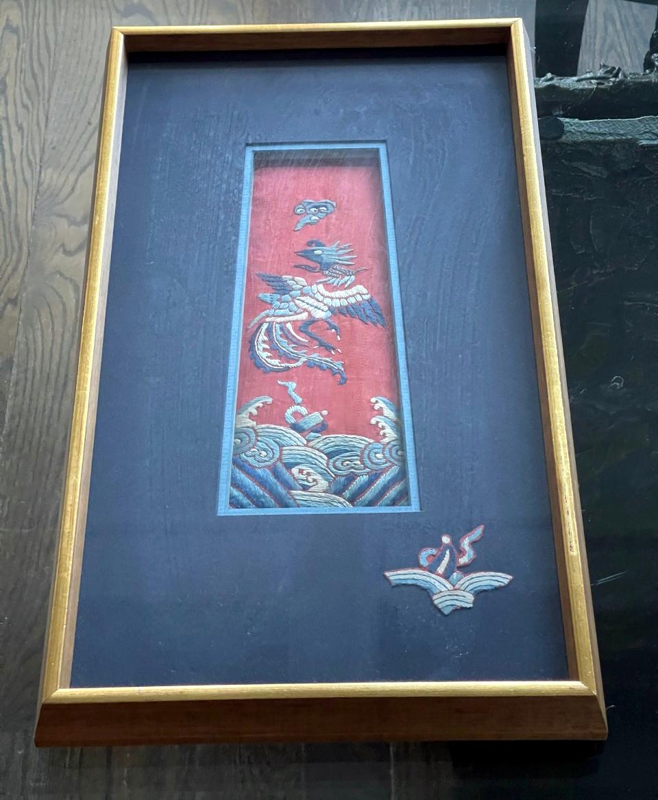 A piece of beautiful antique textile fragments from China, circa 19th century Qing dynasty, artistically displayed in a giltwood frame with contrast blue color cloth matts. Originally it was an embroidered panel of a wedding skirt worn by Manchurian